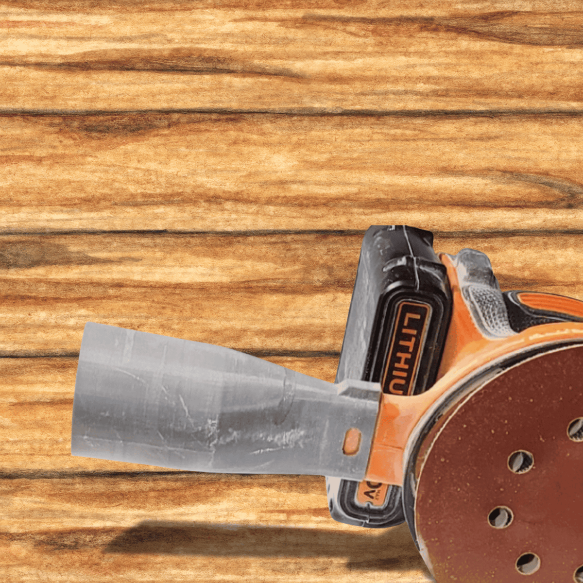 Sanding disc with a glove on a wooden surface