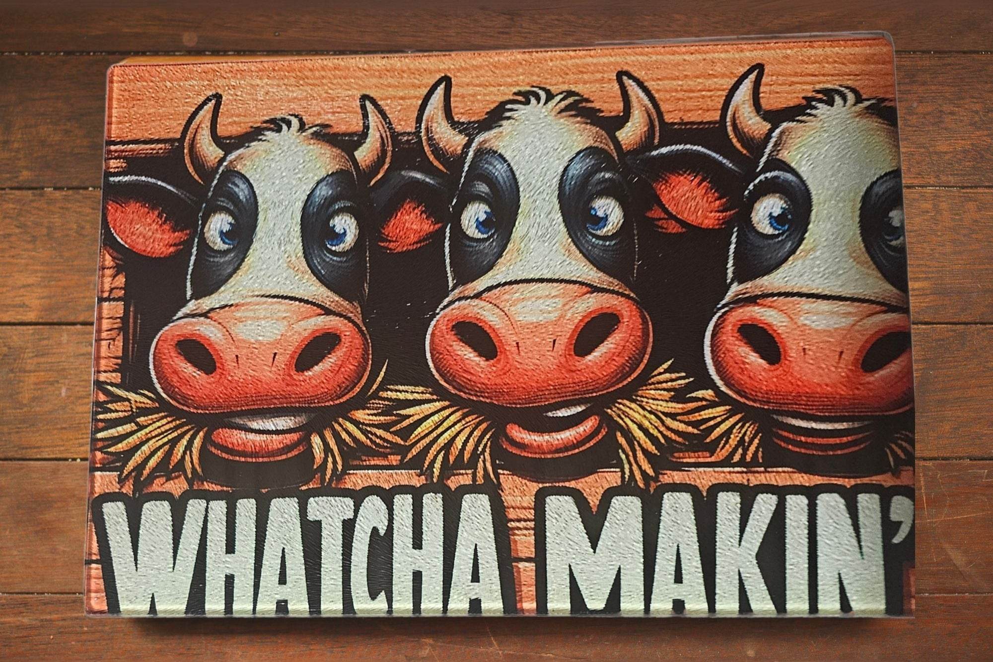 Ahoy Multicolor Cow Kitchen Cutting Board with bright cow illustrations on shatter-resistant, extra-durable glass.