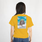 Mustard memorial T-shirt back print featuring a photo, name, dates, an arch, and gentle doves against a blue sky.