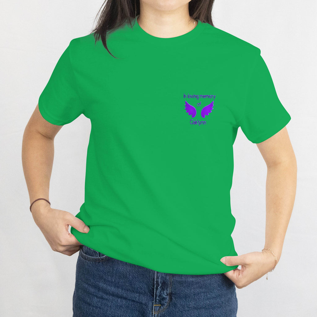 Bright green T-shirt with a small purple memorial design of wings and the name Oaklynn, In loving memory on the chest.