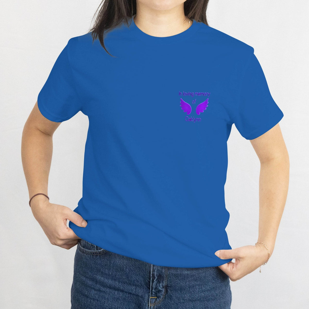 Blue memorial T-shirt with a purple winged design and in loving memory text on the chest.