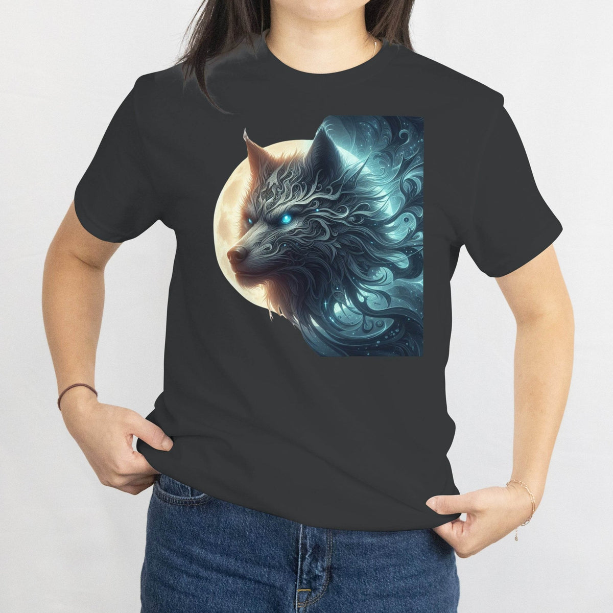 Person wearing a black t-shirt with a blue wolf graphic design on a plain background
