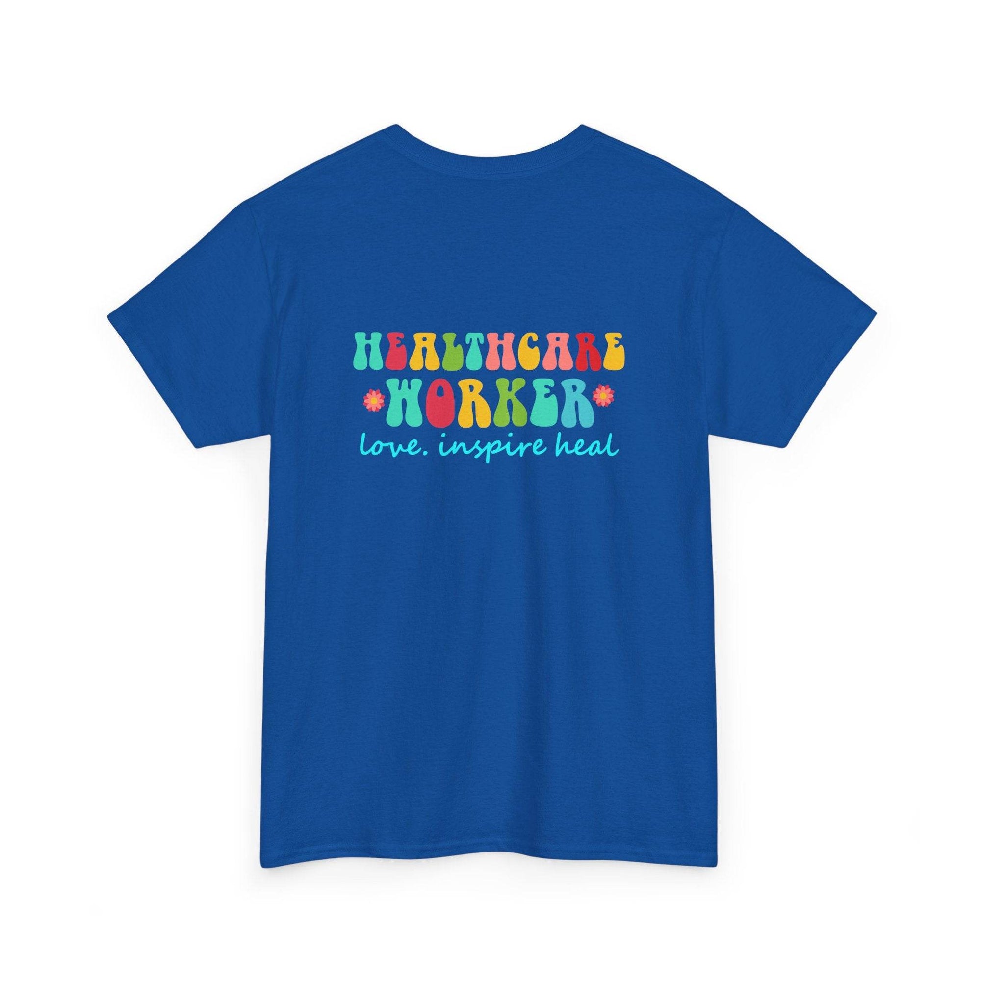 Blue t-shirt with colorful Healthcare Worker graphic and love. inspire heal slogan with flower accents.