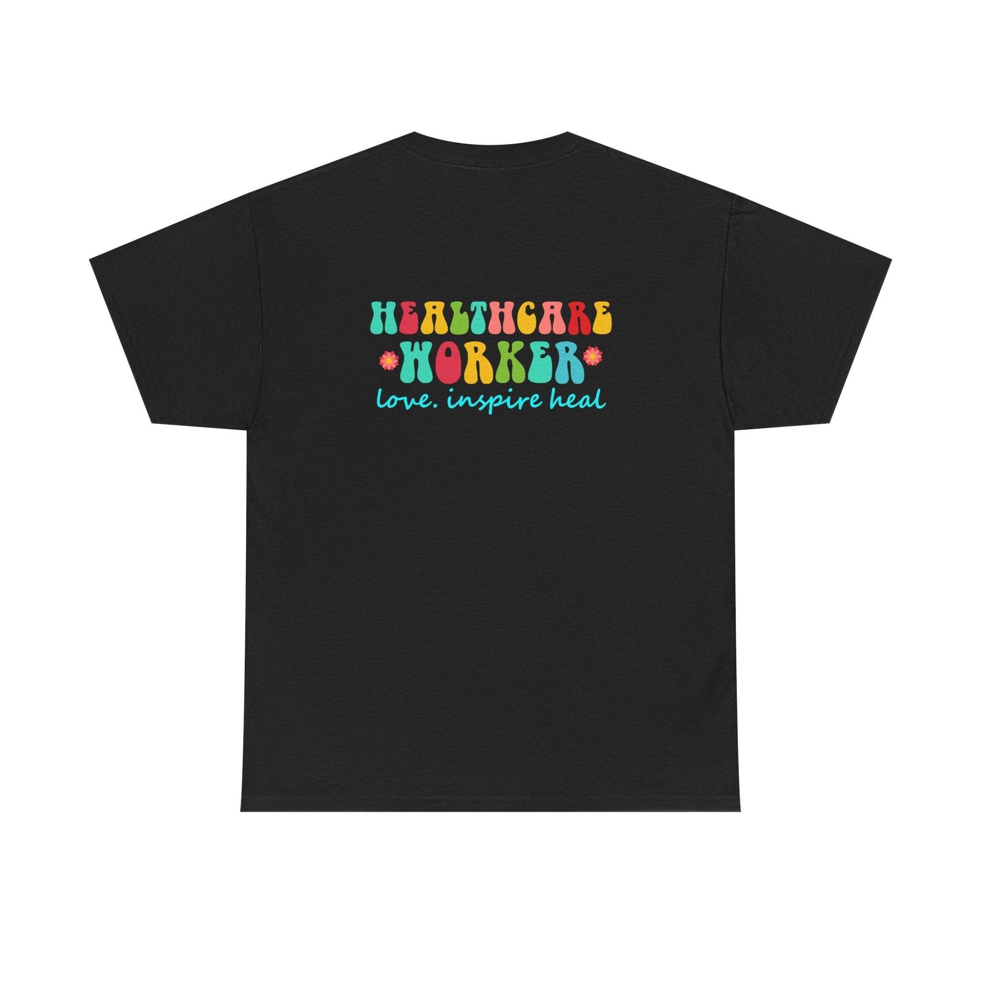 Black tee featuring a bright Healthcare Worker graphic with the love. inspire heal slogan