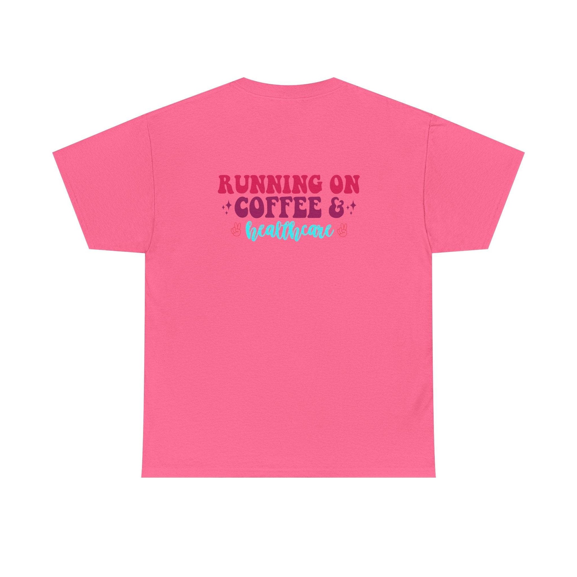 Pink T-shirt with back graphic reading RUNNING ON COFFEE & healthcare in burgundy and turquoise script.