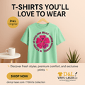 Green t-shirt with pink flower design on a hanger against a beige background, featuring D&L Vinyl-Laser LLC branding.