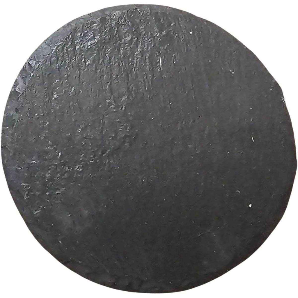 Round black stone on a white background