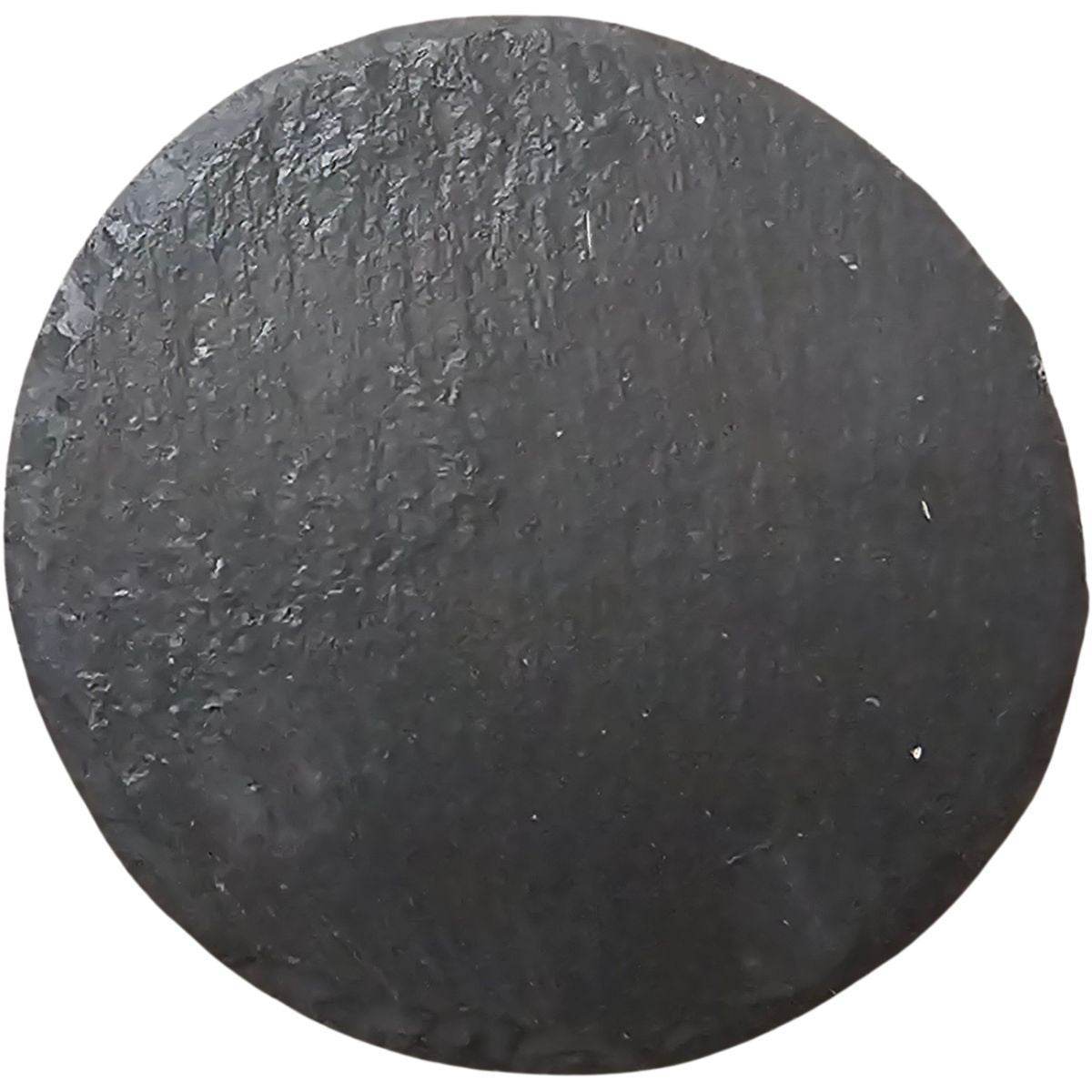 Round black slate coaster with textured surface for bar use.