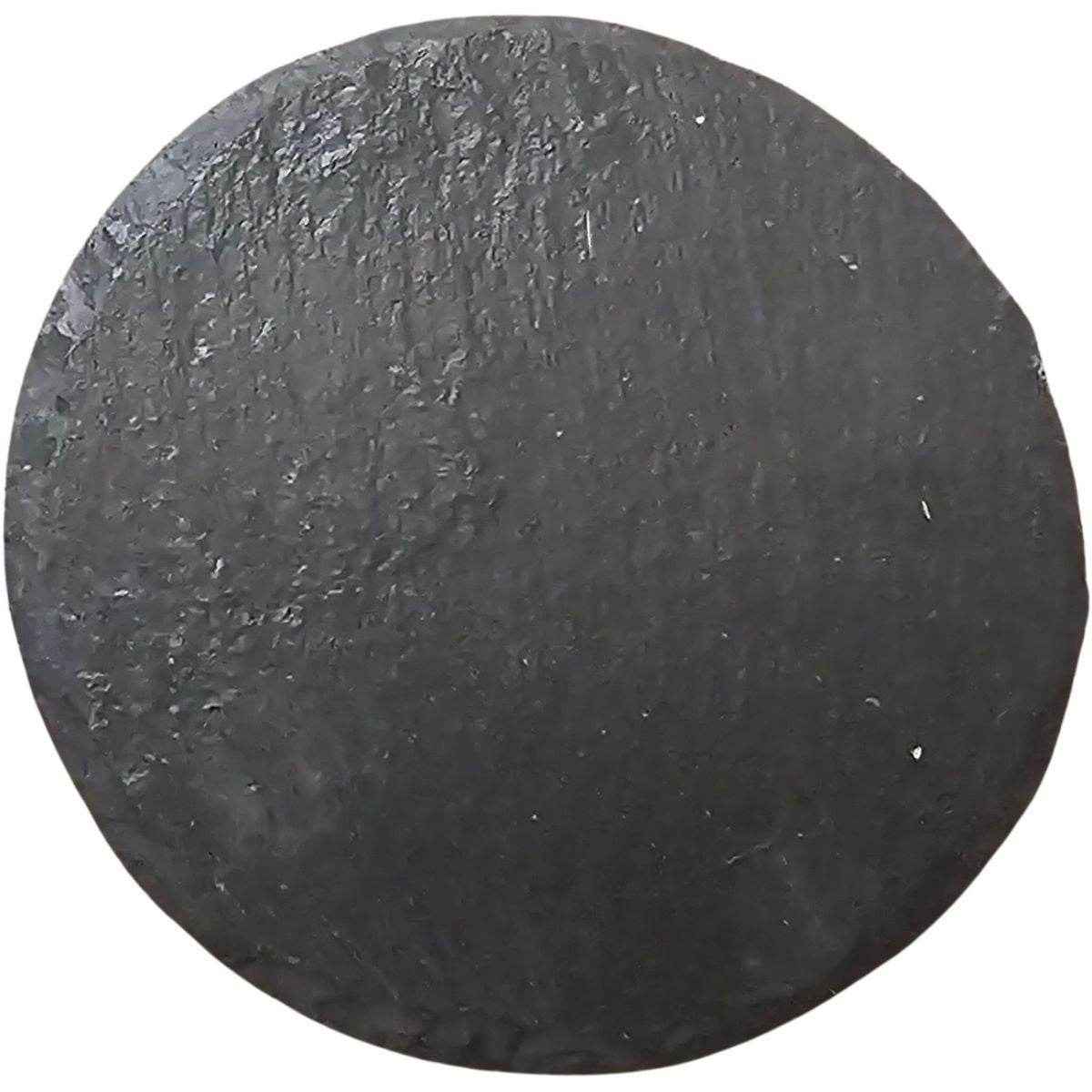 Round black stone on a white background