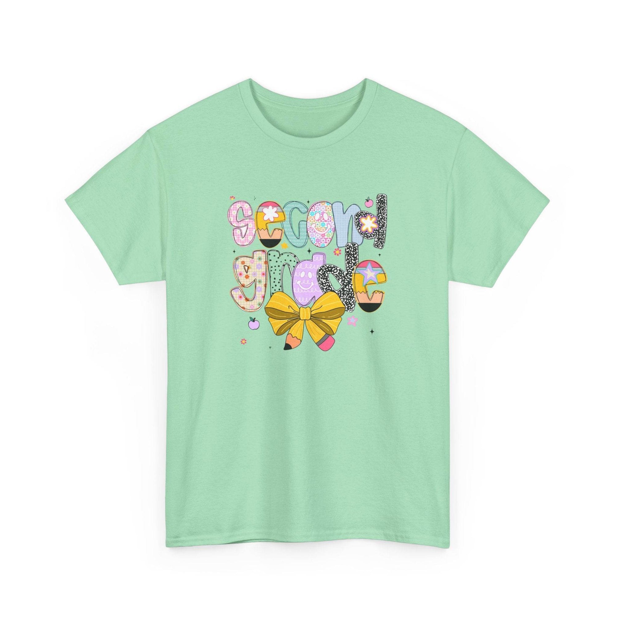 Mint green 2nd grade youth T-shirt with colorful patterned 'school girl' lettering and a yellow bow.