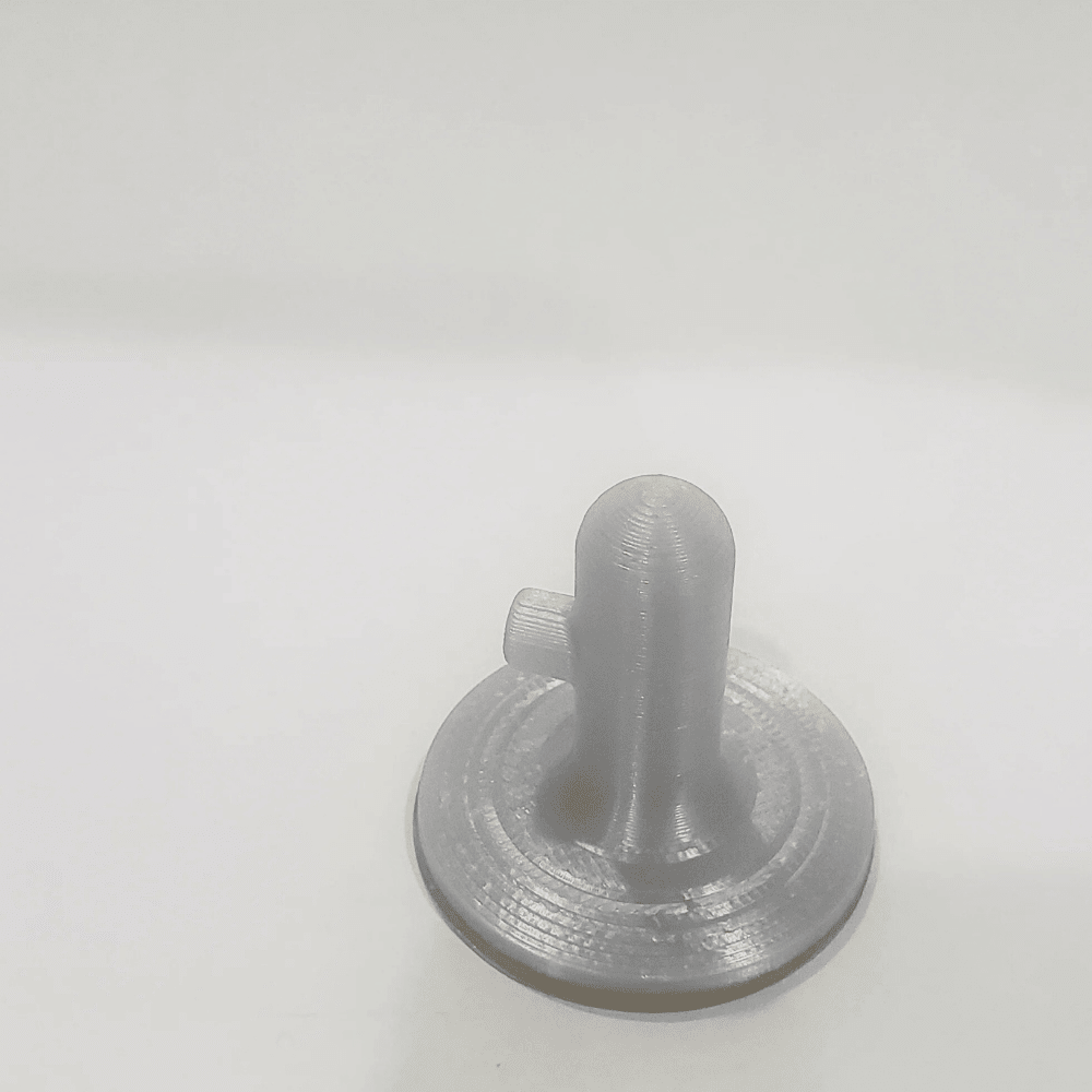 Gray plastic component on a white background