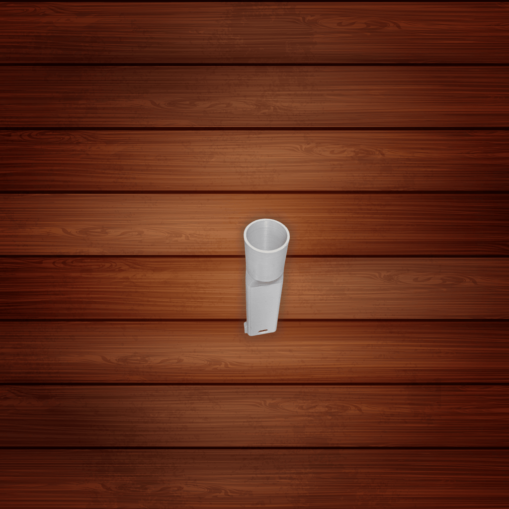White plastic pipe against a wooden background