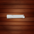 White plastic component on a wooden background