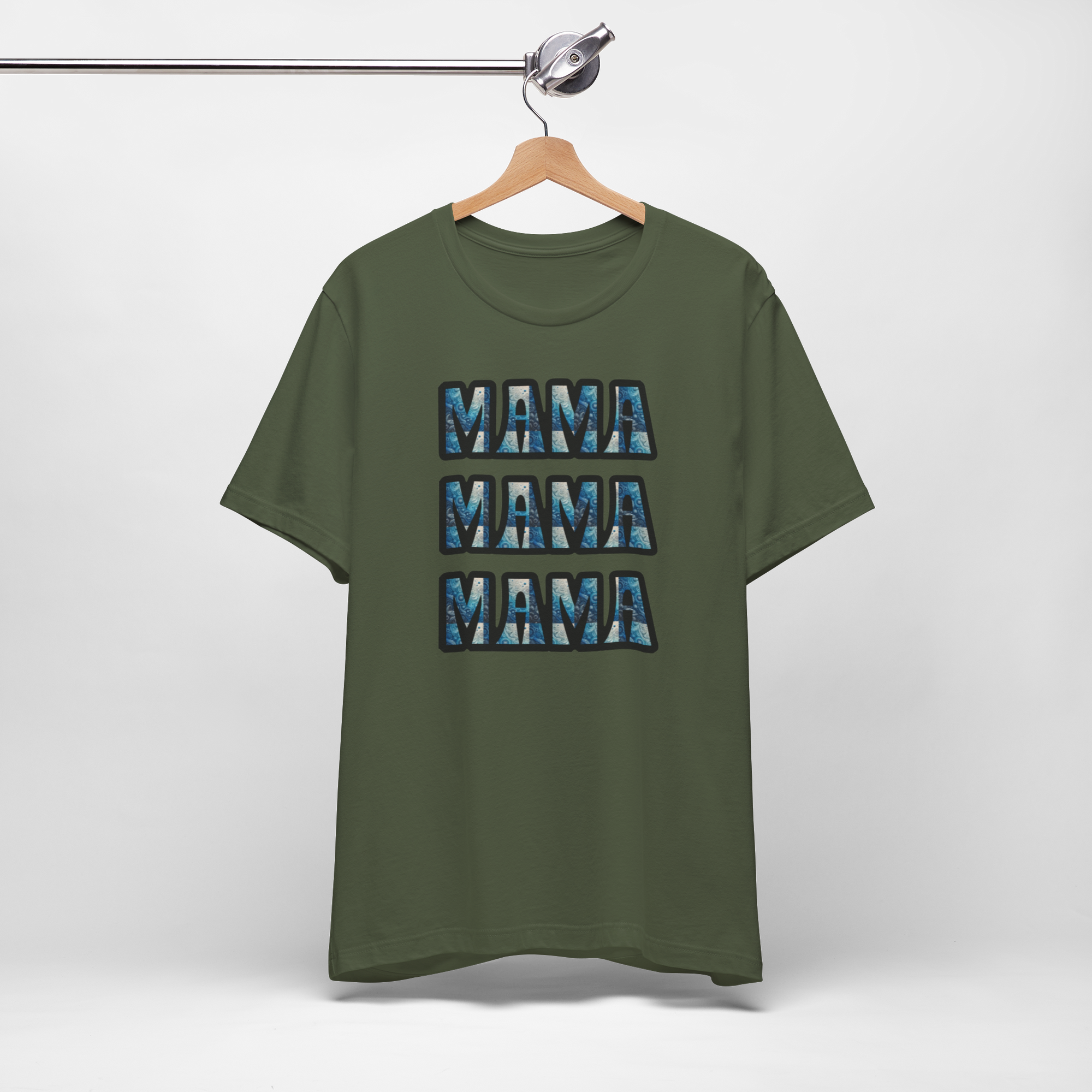 Olive-green T-shirt on a hanger with four stacked blue-patterned "MAMA" blocks.