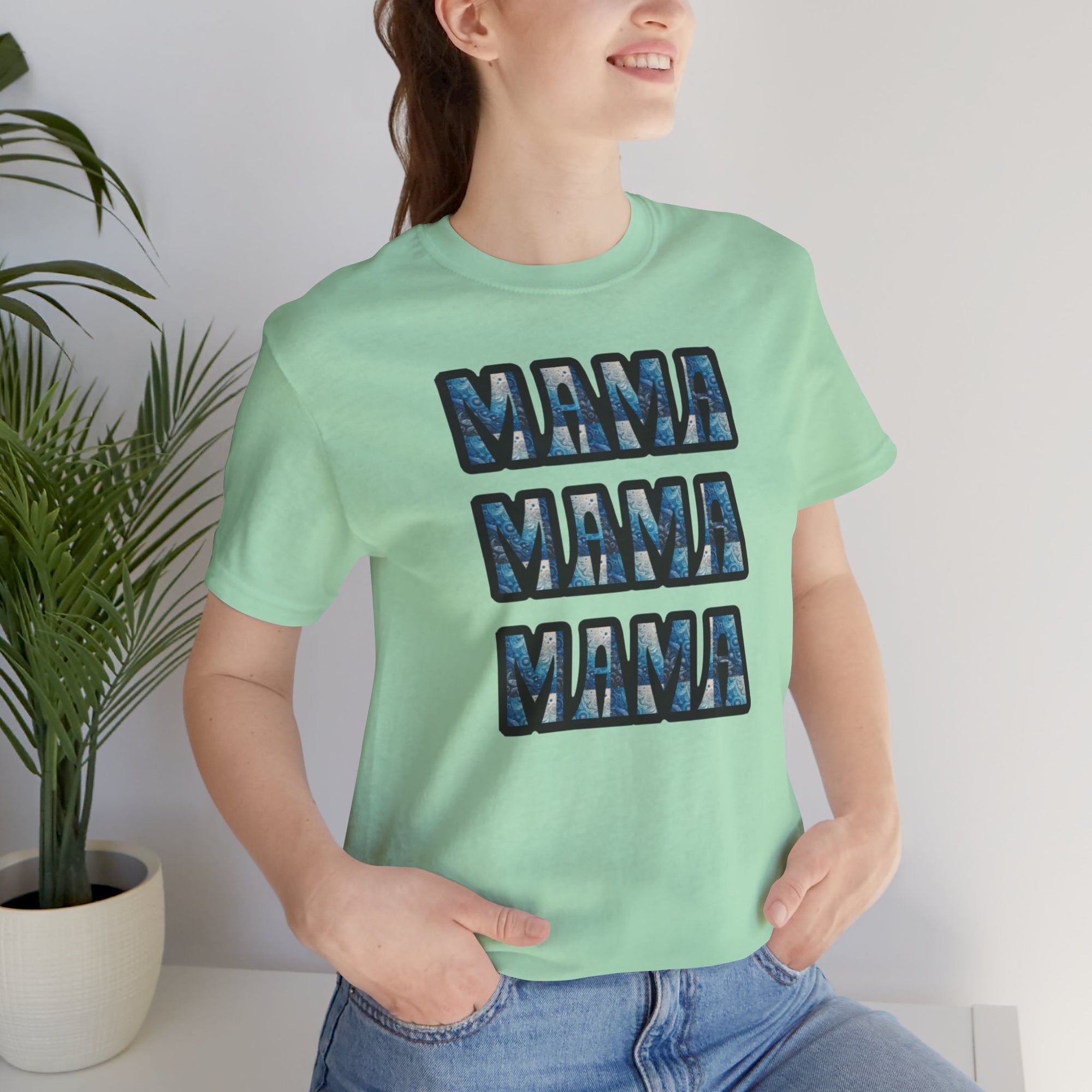 Mint green Mama Mama Mama graphic tee on Bella Canvas 3001 with three stacked blue patterned MAMA letters.