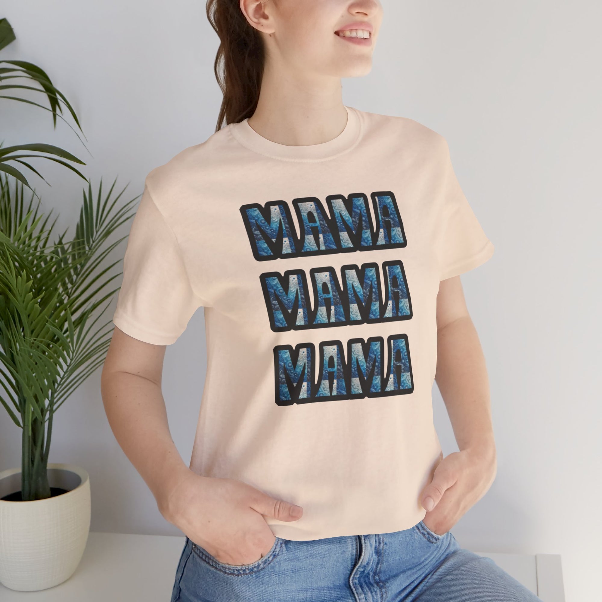 Mama Mama Mama graphic tee on a girl, three stacked blue marbled MAMA letters on beige Bella Canvas 3001 shirt.
