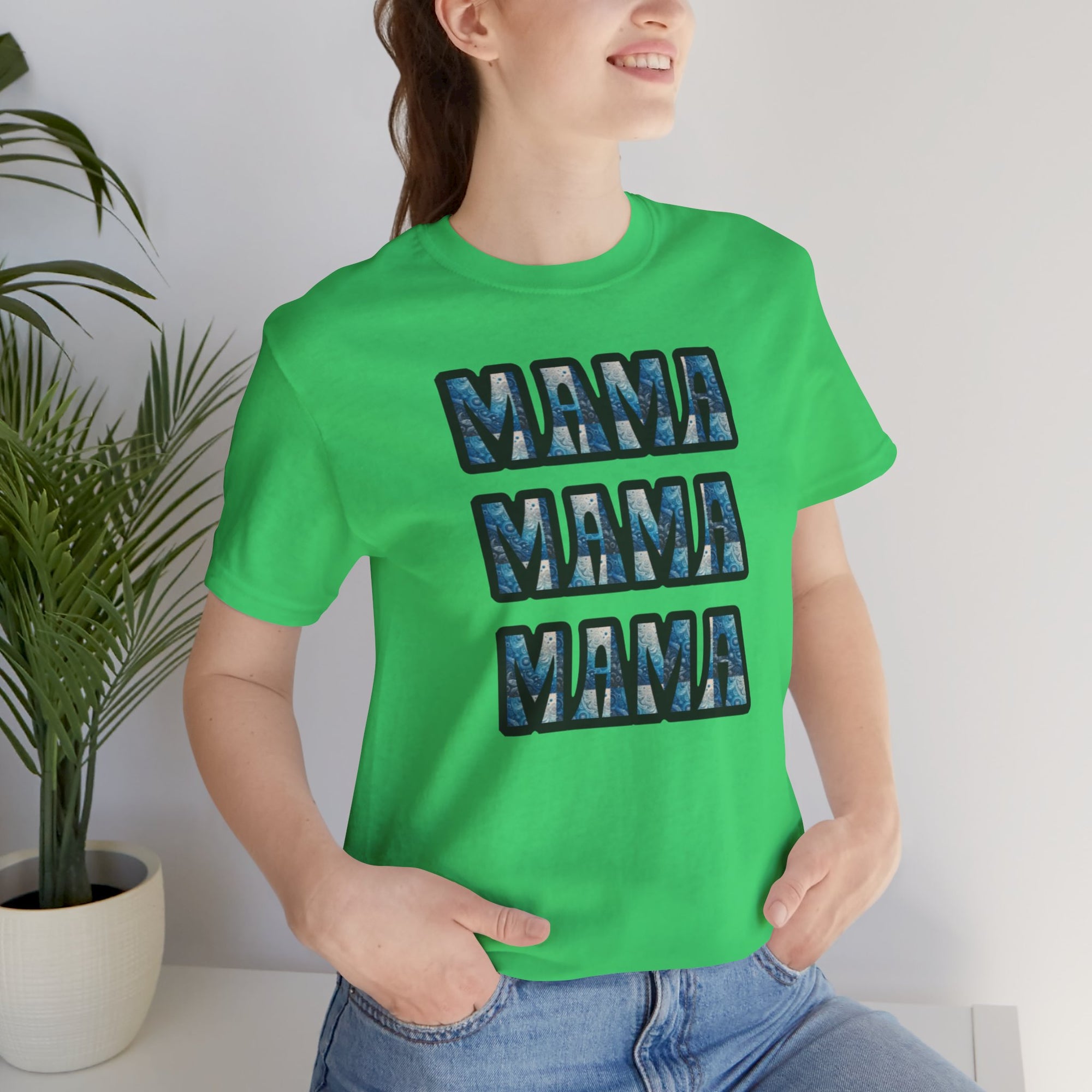 Mama Mama Mama Graphic T shirt in bright green worn by a smiling woman, featuring three stacked blue MAMA text.