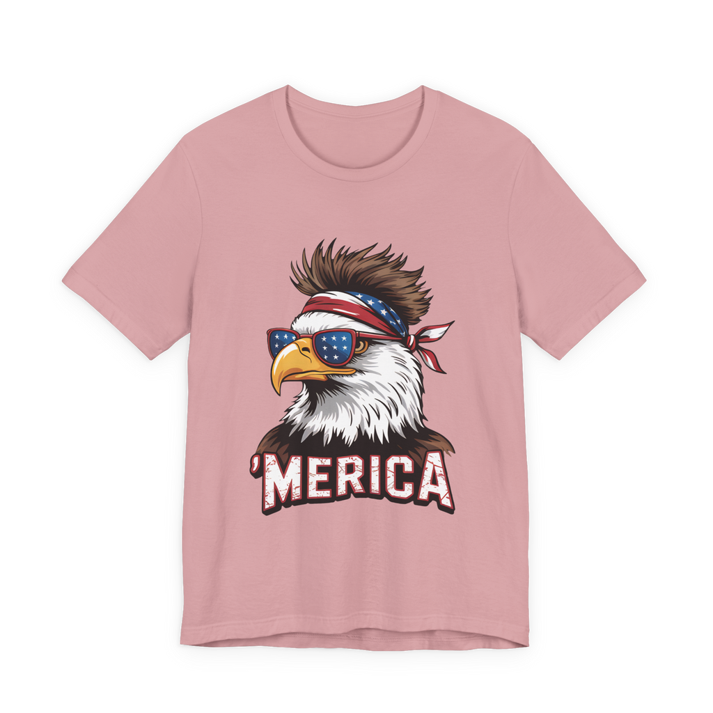Pink Bella Canvas T-shirt featuring a bold eagle graphic with American flag bandana, star sunglasses, and MERICA text.