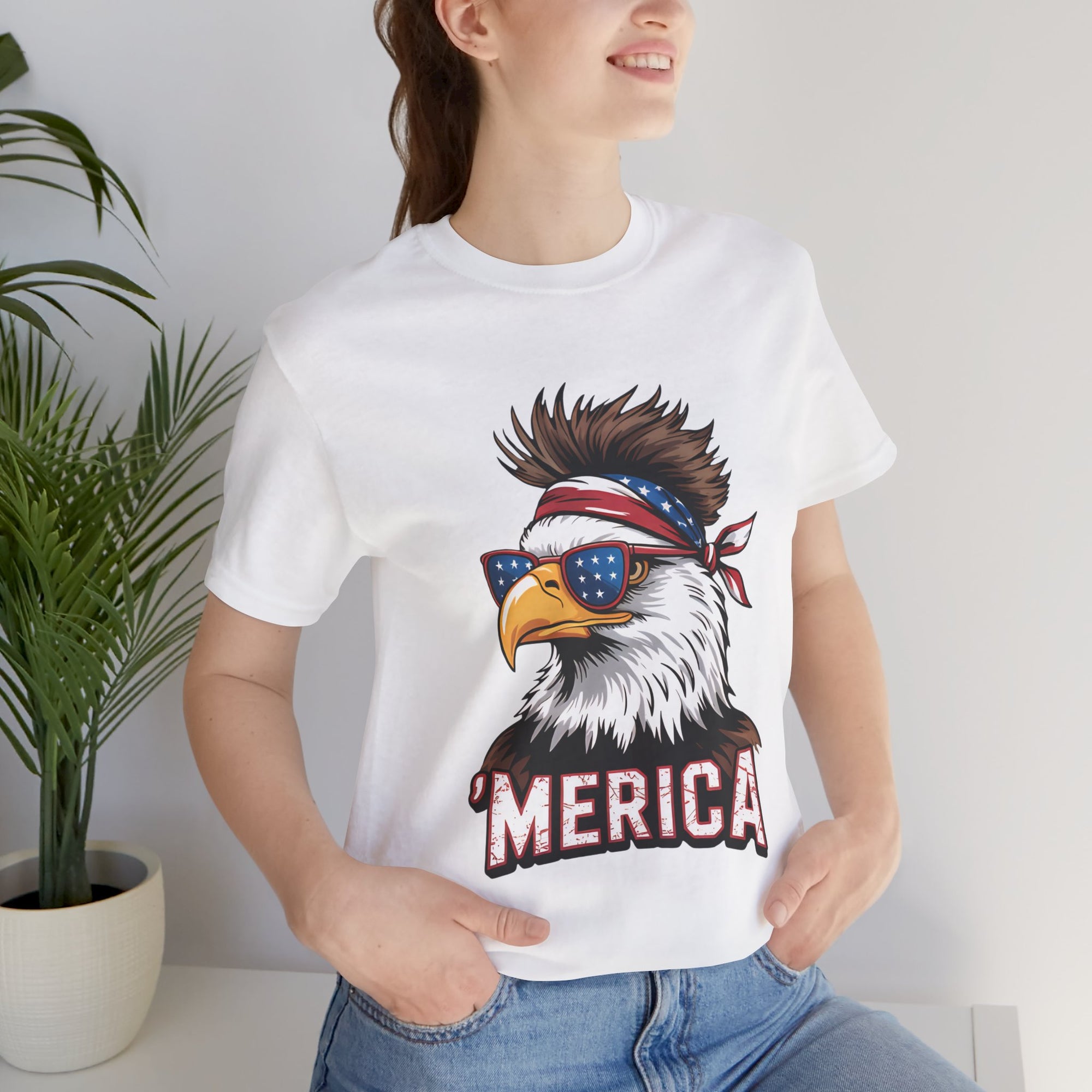White unisex T-shirt with patriotic eagle graphic wearing star-spangled sunglasses and bandana, MERICA text.
