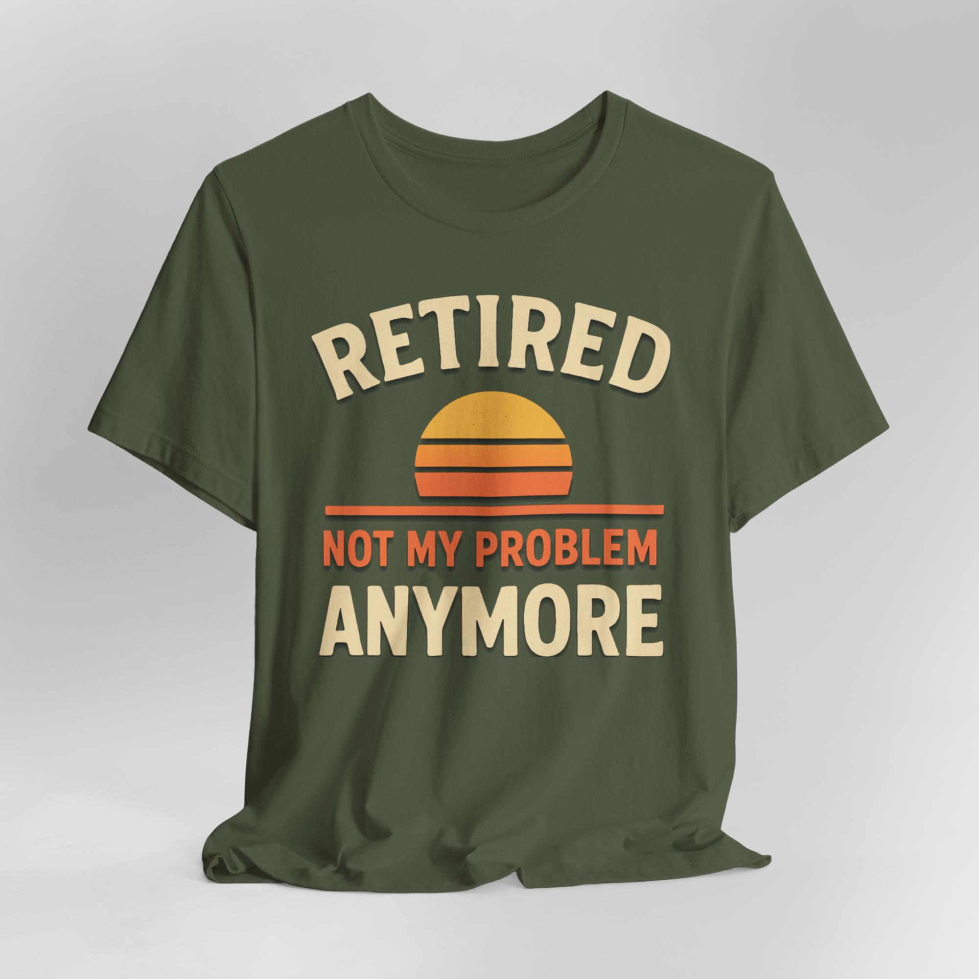 Olive green T-shirt featuring RETIRED, sunset arc, and NOT MY PROBLEM ANYMORE text