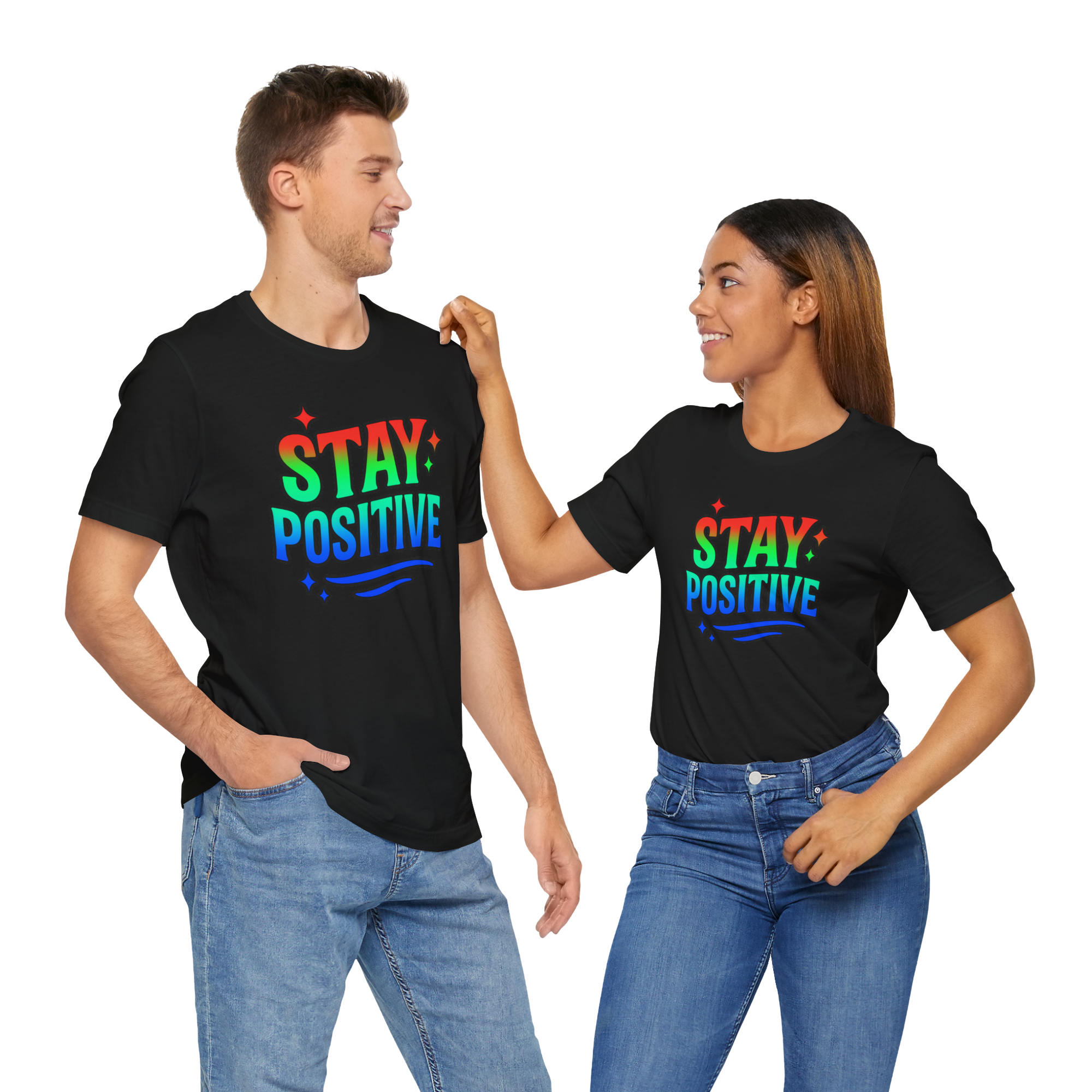 Man and woman wearing Stay Positive T-shirts with rainbow text, posing together.