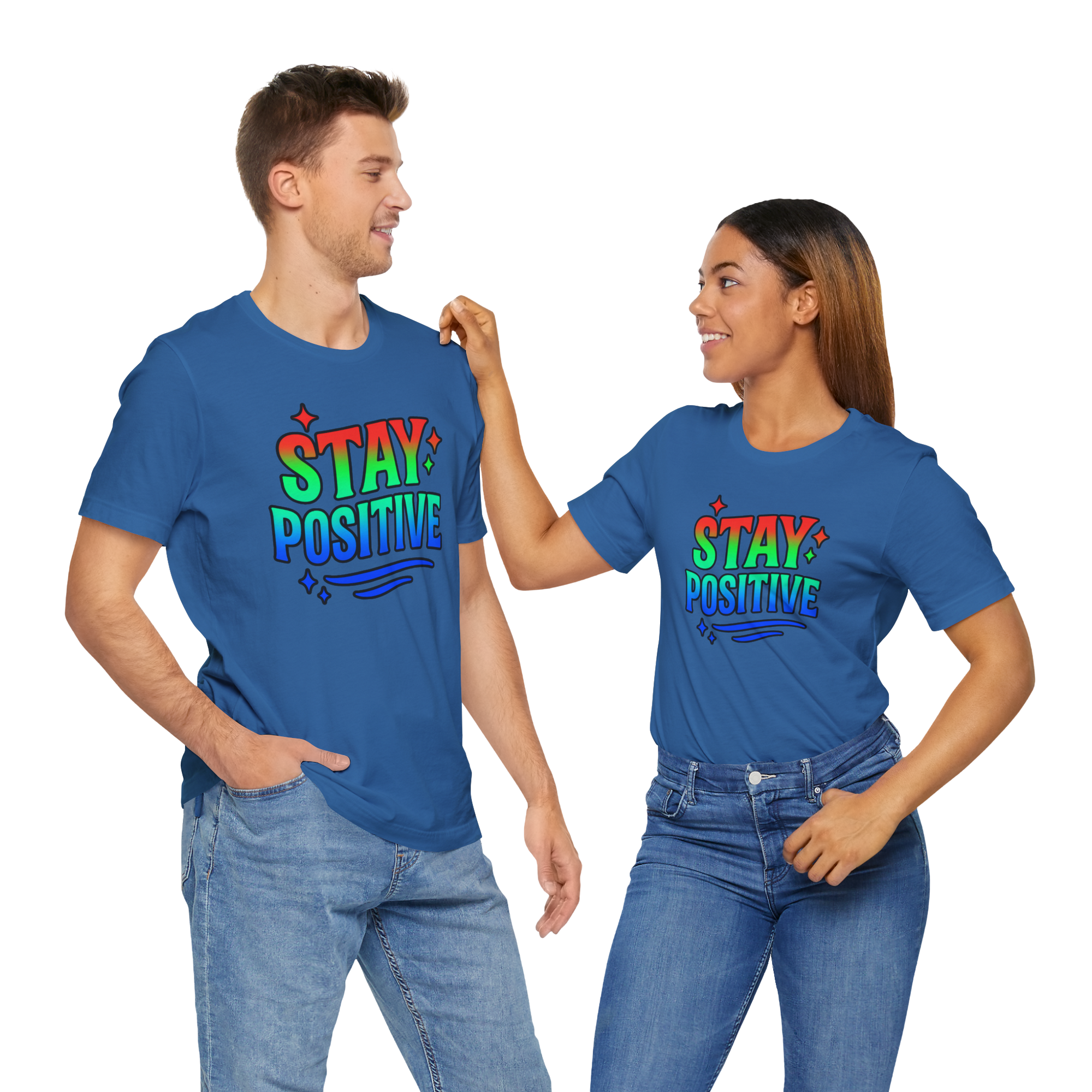 Two people wearing blue Stay Positive t-shirts with rainbow lettering and decorative stars.