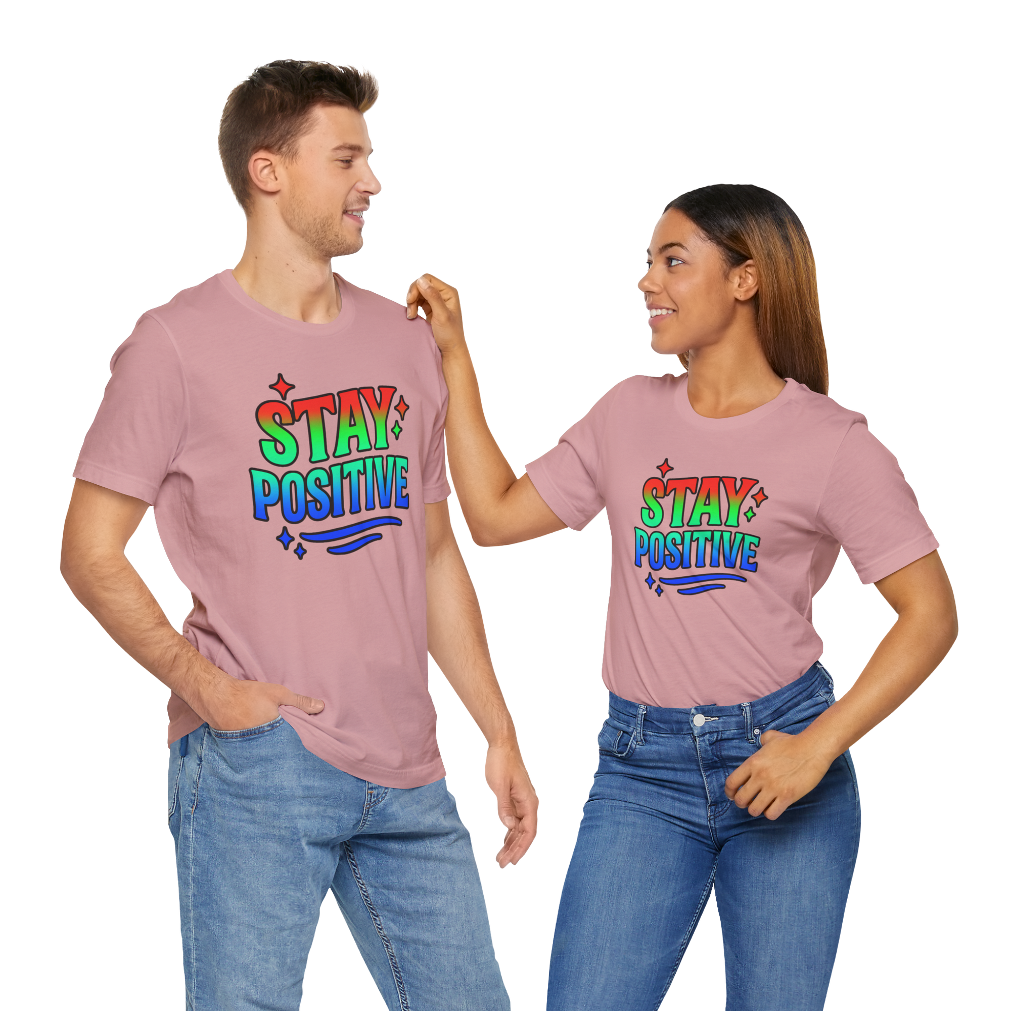 Man and woman in matching pink Stay Positive t-shirts with rainbow text design.