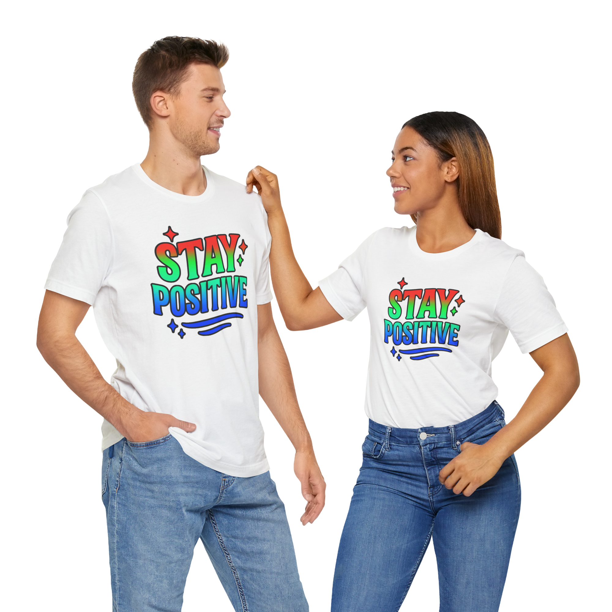 Two people wearing Stay Positive T-shirts with rainbow lettering, smiling at each other.