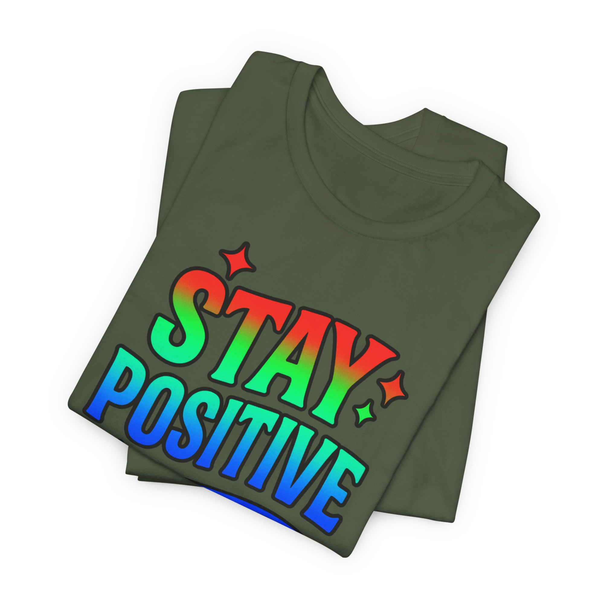 Olive-green T-shirt folded with a rainbow Stay Positive slogan.