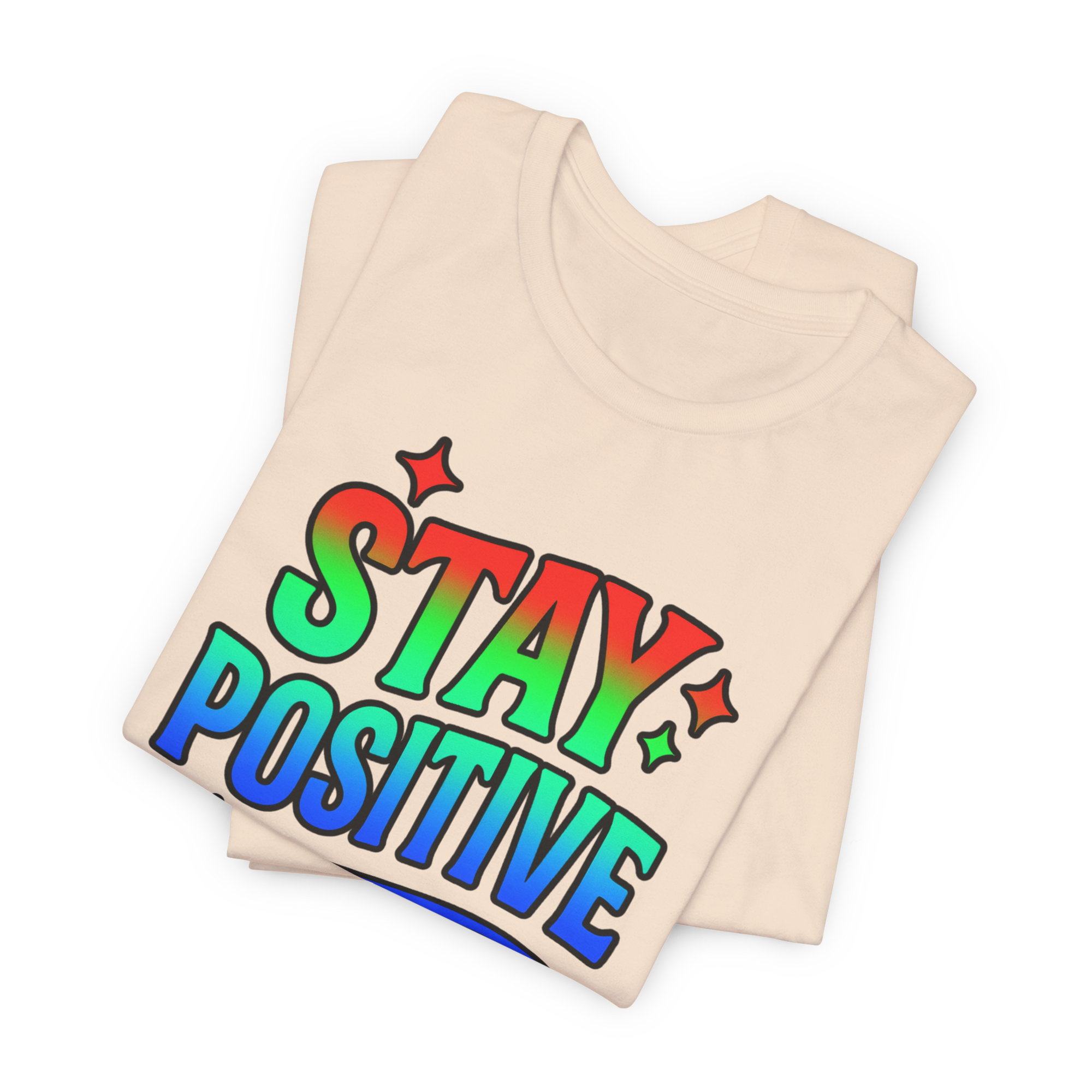 Beige tee with rainbow Stay Positive graphic and star accents.