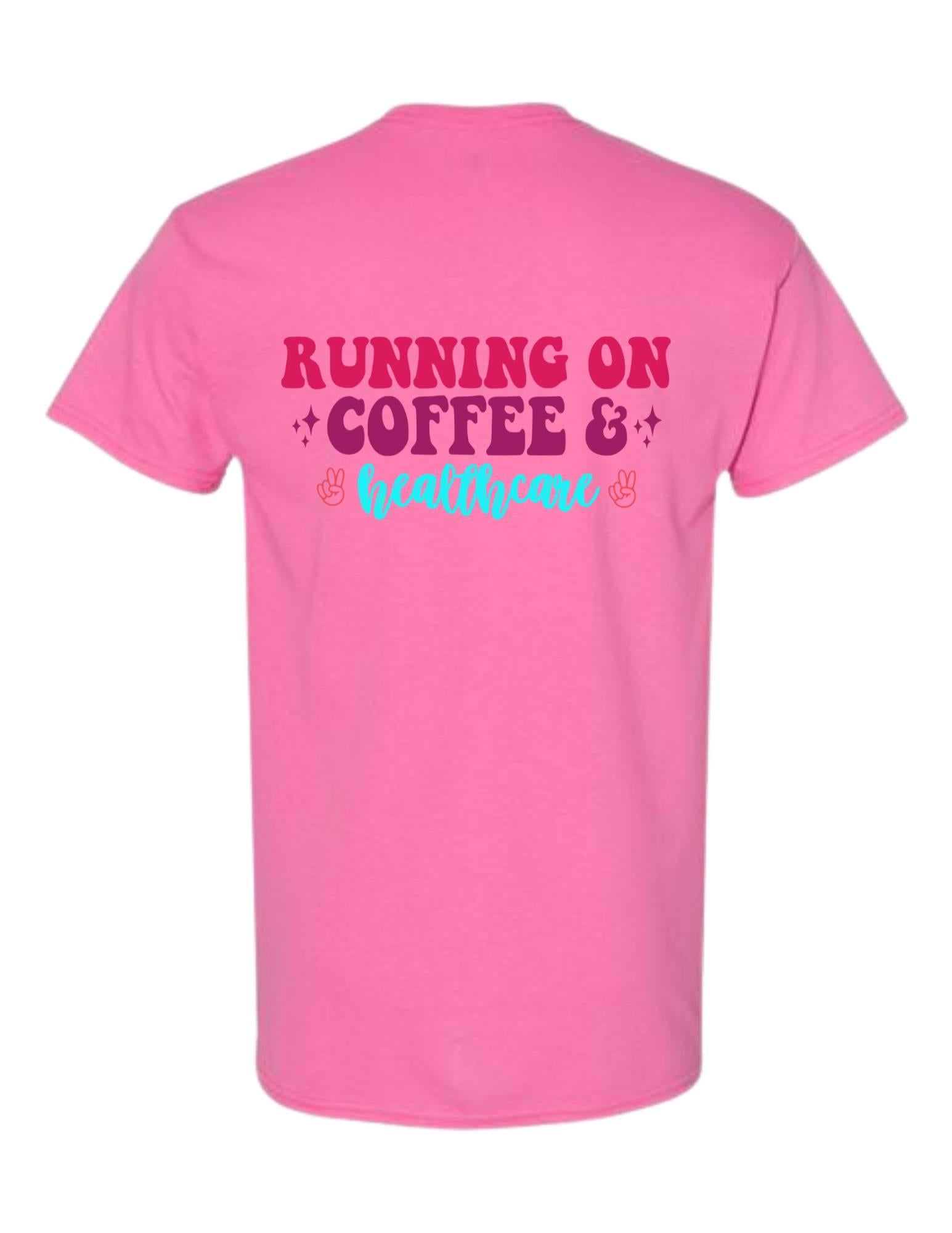 Pink t-shirt with 'Running on Coffee & Healthcare' text on a white background