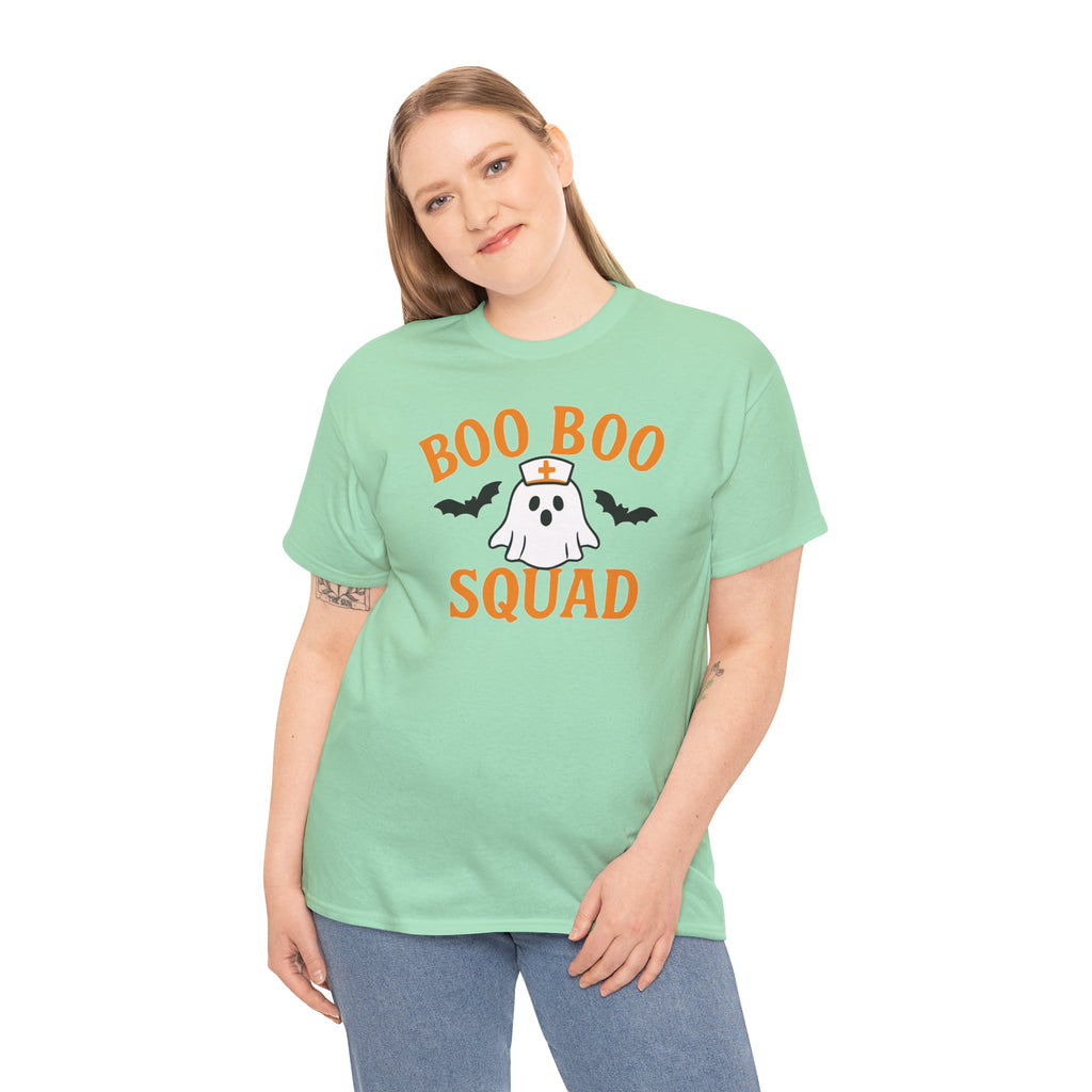 Orange Boo Boo Squad Gildan 5000 tee worn by a woman, mint-green shirt featuring a ghost in a nurse hat with bats.