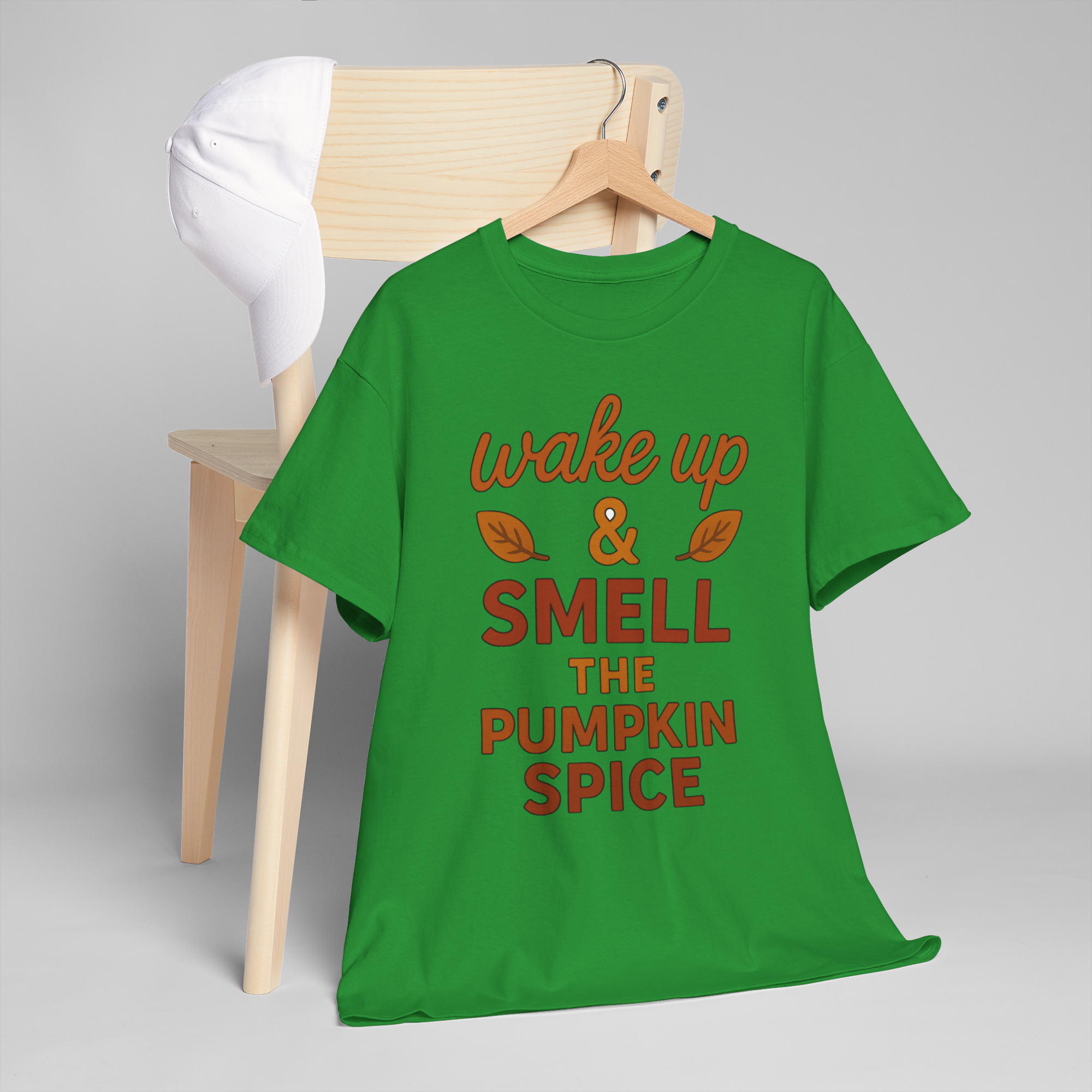 Gildan 5000 pumpkin spice green T-shirt with wake up & smell the pumpkin spice print on a wooden hanger.