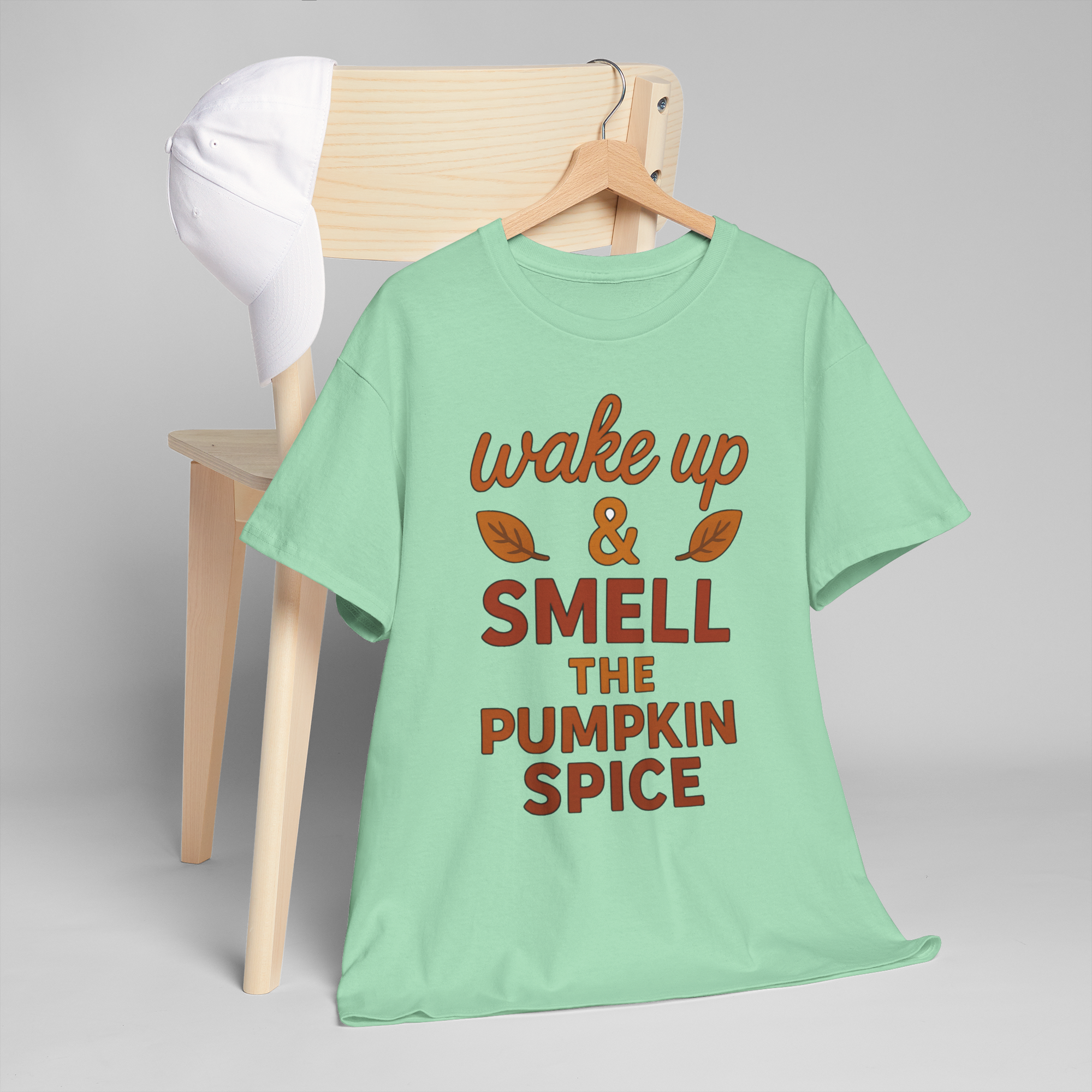Gildan 5000 pumpkin spice mint tee with wake up & smell the pumpkin spice slogan on a hanger