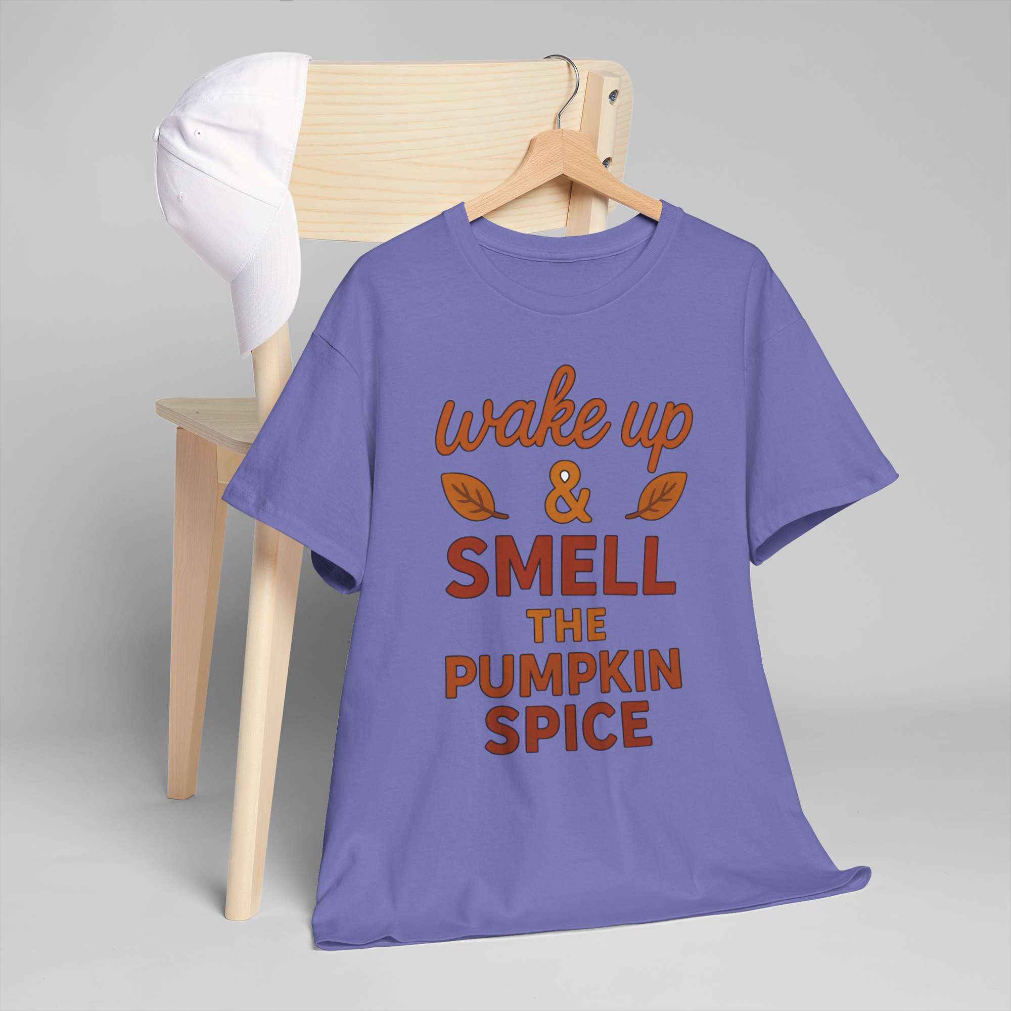 Purple Gildan 5000 tee on a wooden hanger with orange text wake up & smell the pumpkin spice