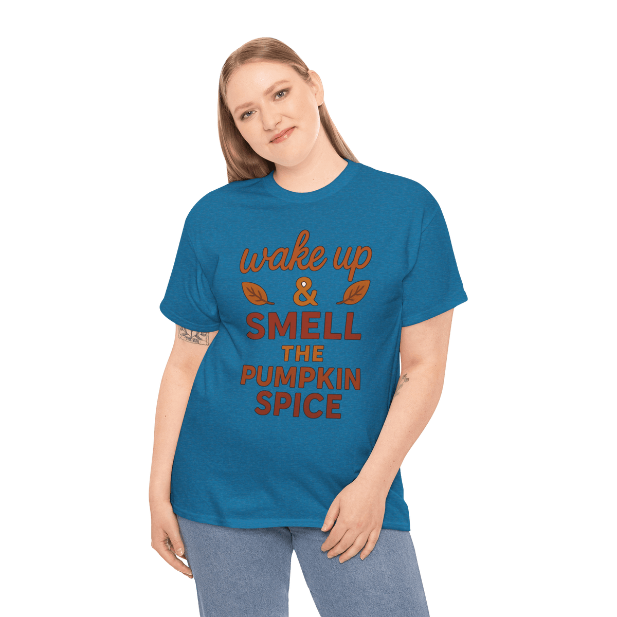 Person wearing gildan 5000 pumpkin spice tee with orange wake up & smell the pumpkin spice text.