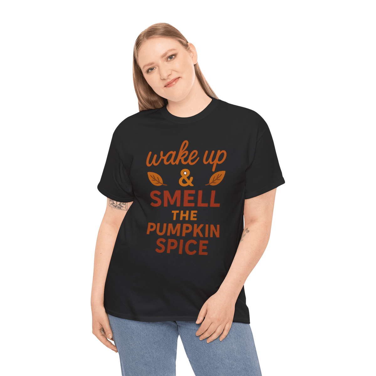 Woman wearing a black gildan 5000 t-shirt with orange wake up & smell the pumpkin spice slogan.