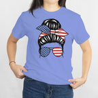 Gildan Patriotic Messy Bun T‑Shirt: messy bun with stars-and-stripes bandana and American flag sunglasses.