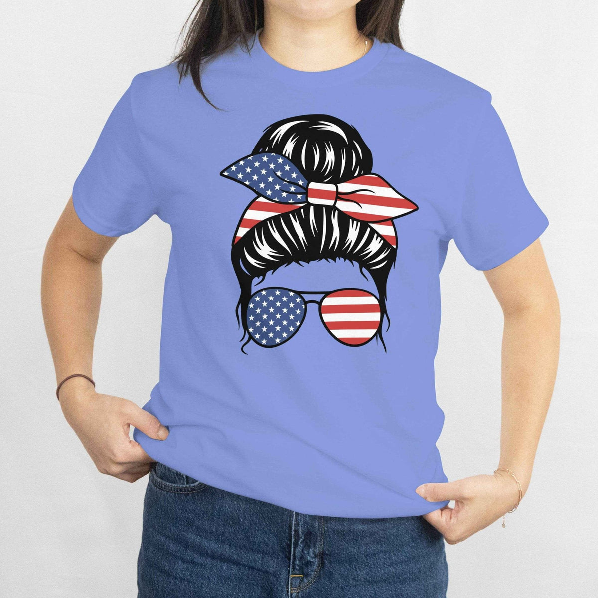 Gildan Patriotic Messy Bun T‑Shirt: messy bun with stars-and-stripes bandana and American flag sunglasses.