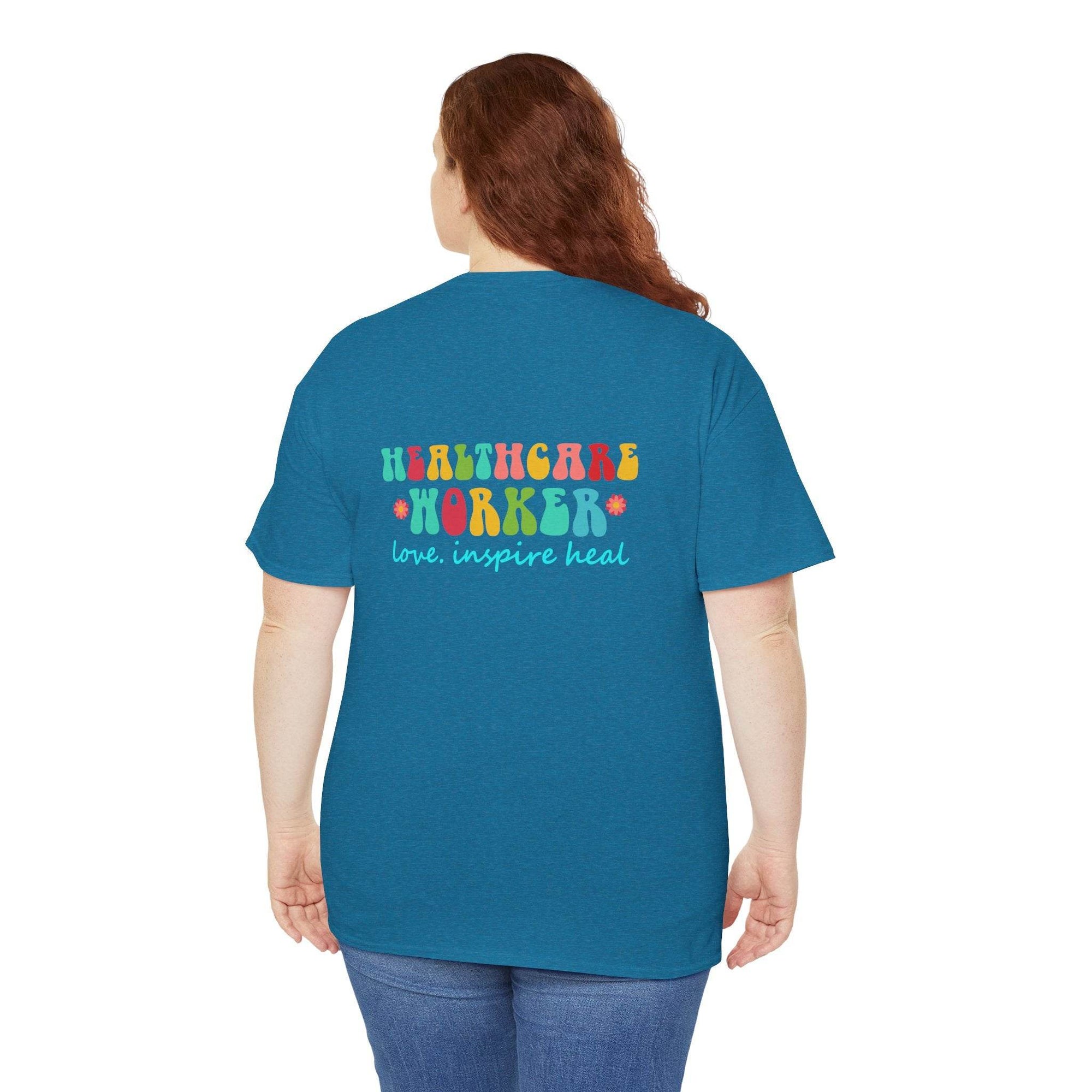 Back view of a blue T-shirt with colorful HEALTHCARE WORKER graphic and love, inspire heal text.