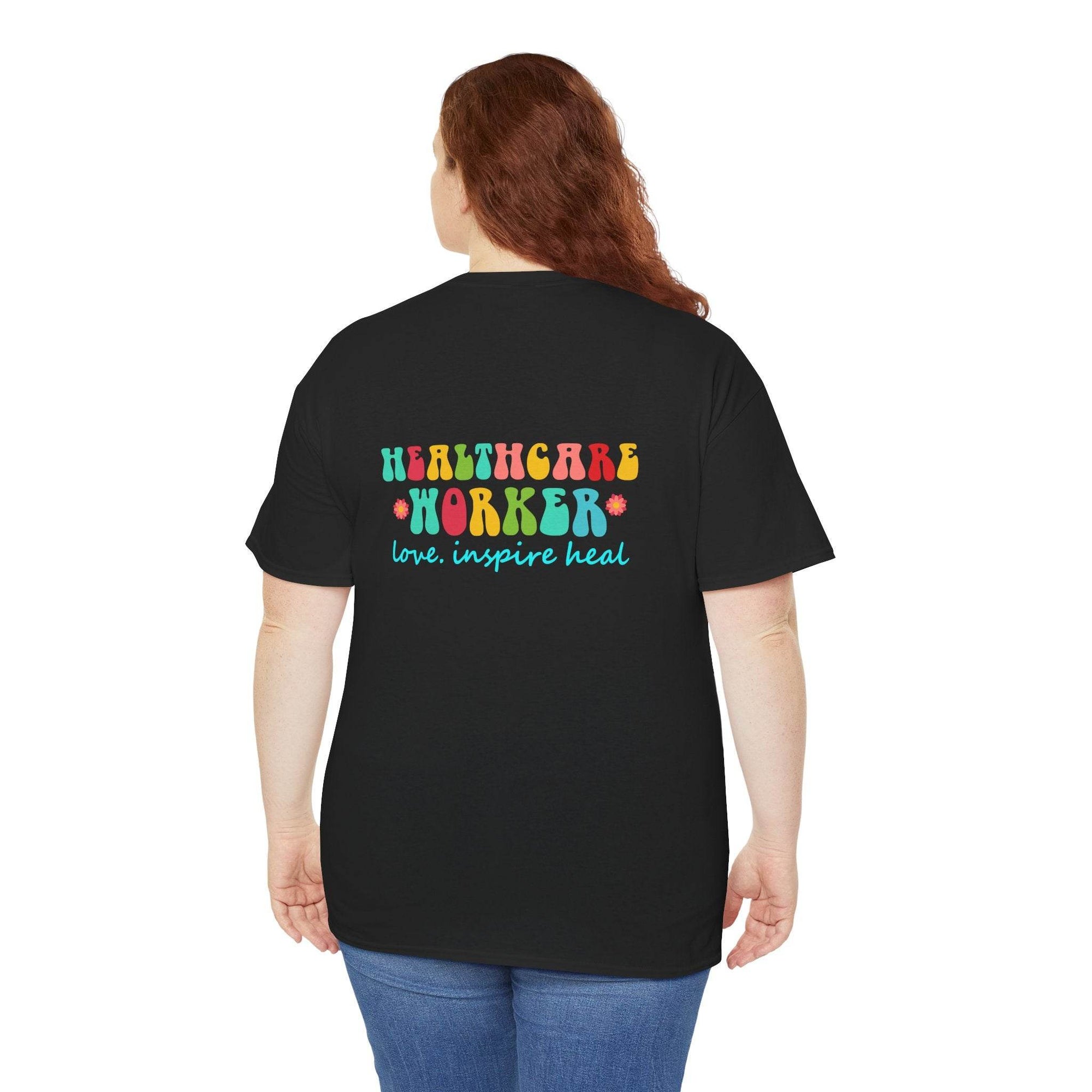Back view of black healthcare workers T-shirt with colorful Healthcare Worker text and love inspire heal slogan.