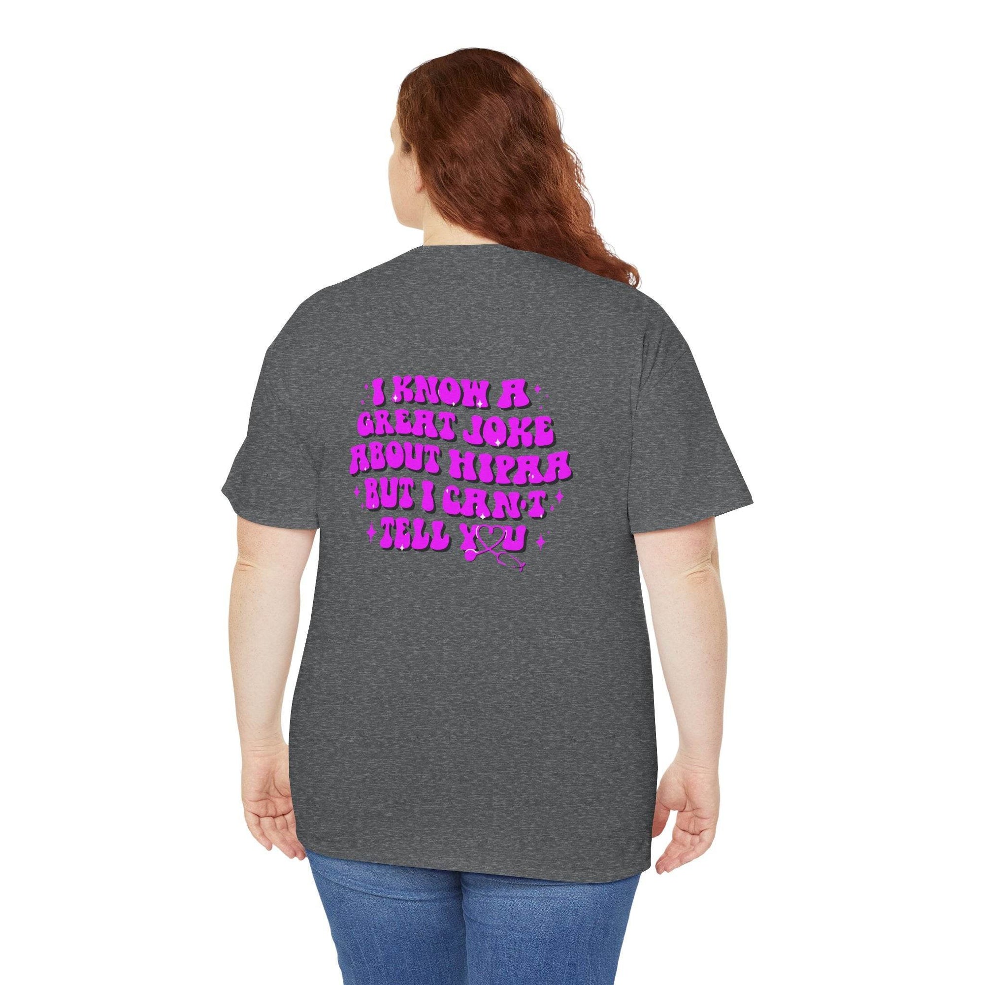 Back view of a person wearing a heather gray T-shirt with pink HIPAA joke text on the back.