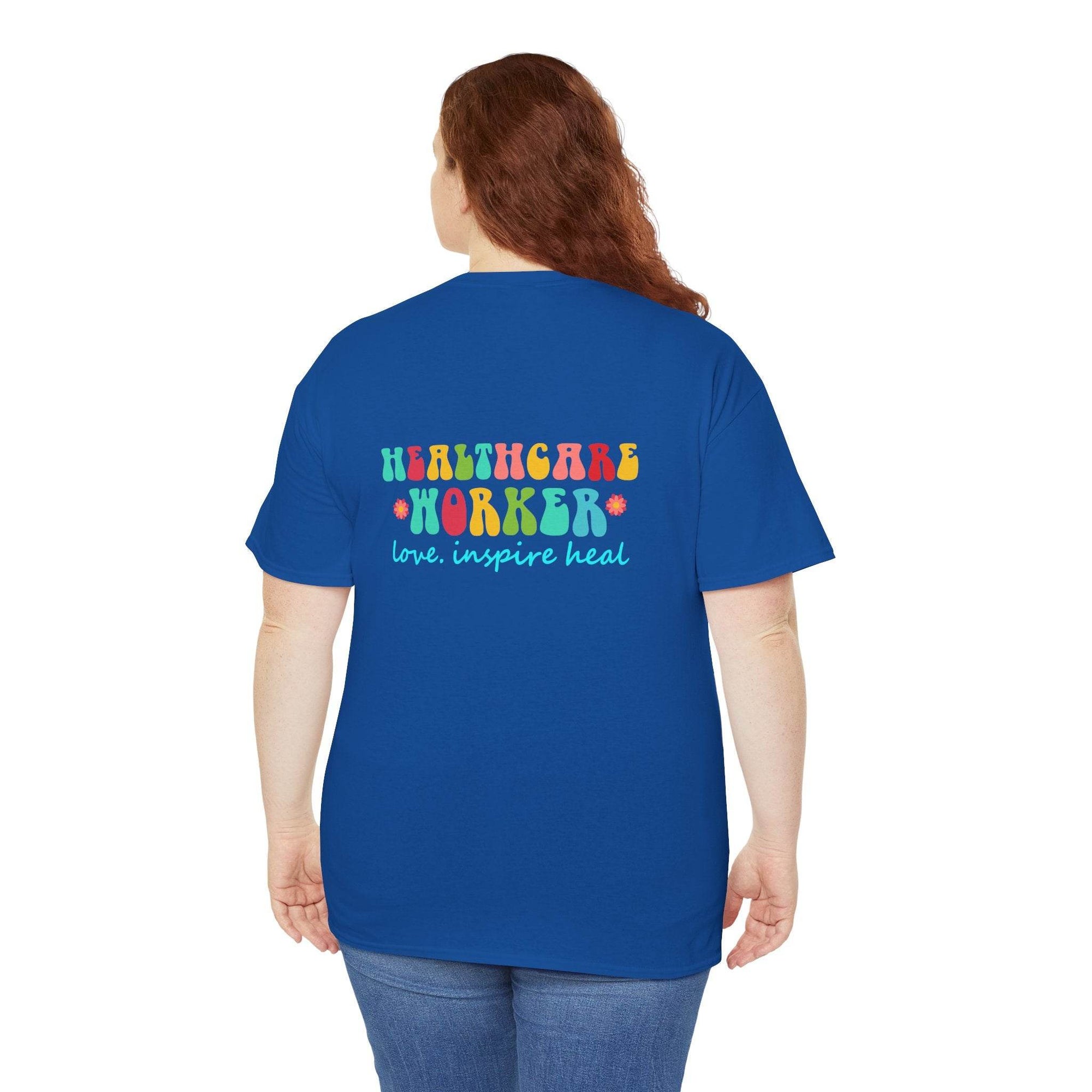 Back view of a royal blue T-shirt with colorful "Healthcare Worker" text and "love inspire heal" slogan.