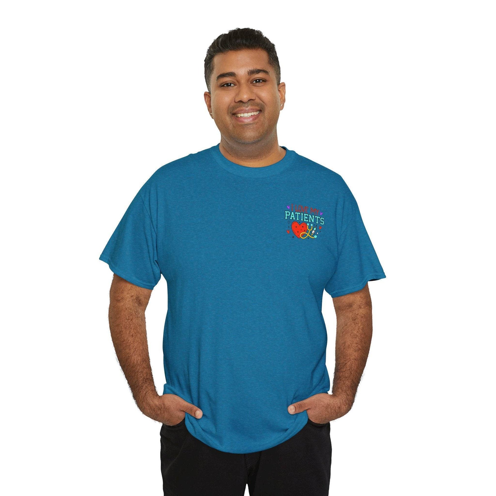 Smiling man in teal T-shirt with 'I Love My Patients' graphic on chest.