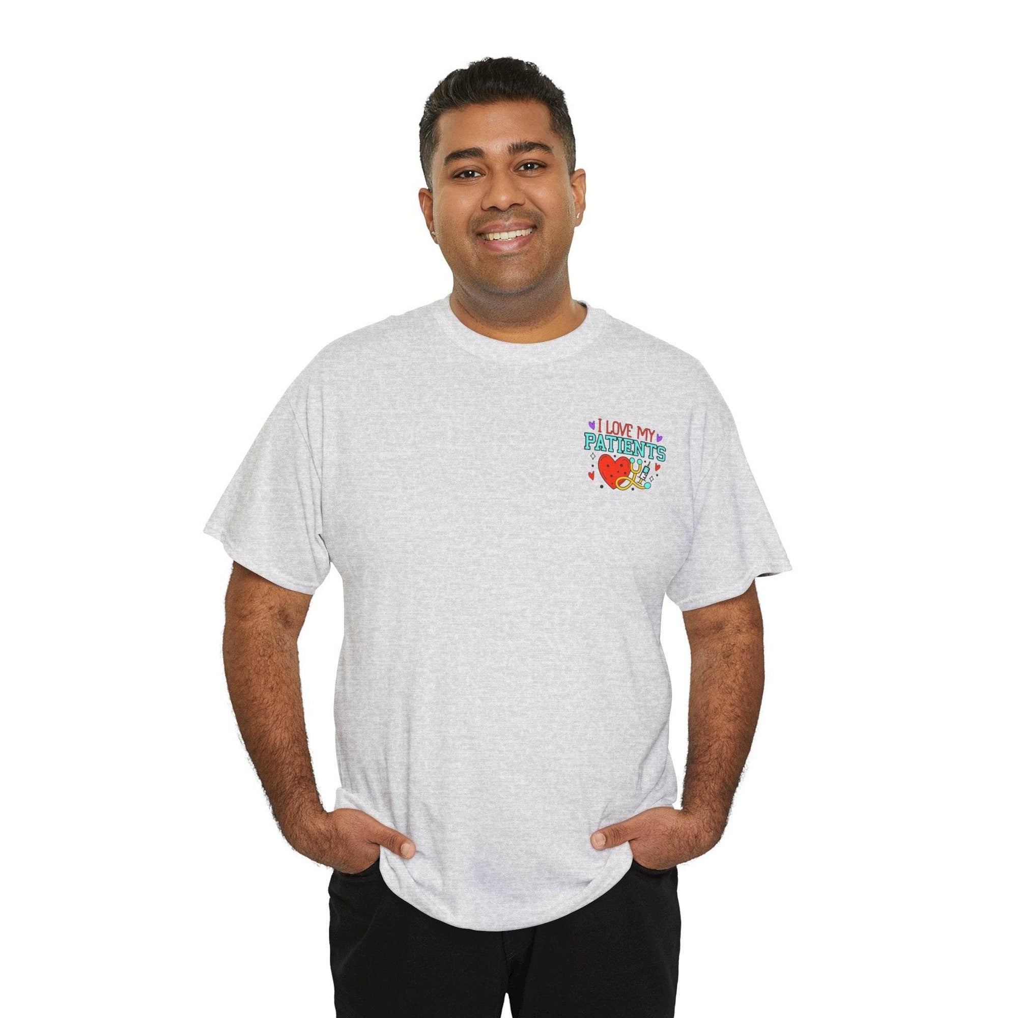Smiling man wearing a light gray Healthcare Workers T-shirt with an "I LOVE MY PATIENTS" graphic on the chest.