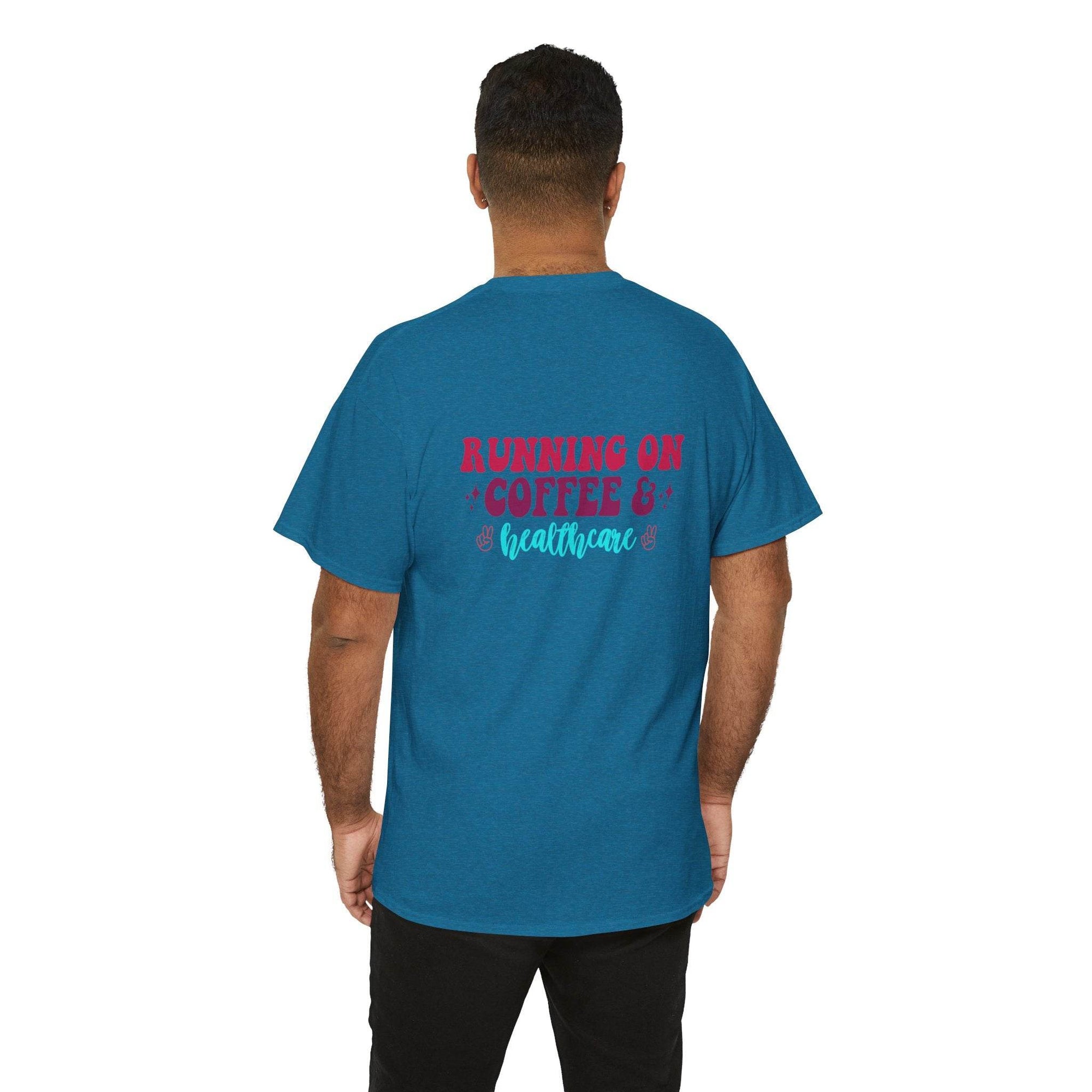 Back view of a man in a teal T-shirt with pink RUNNING ON COFFEE & healthcare in blue on the back.
