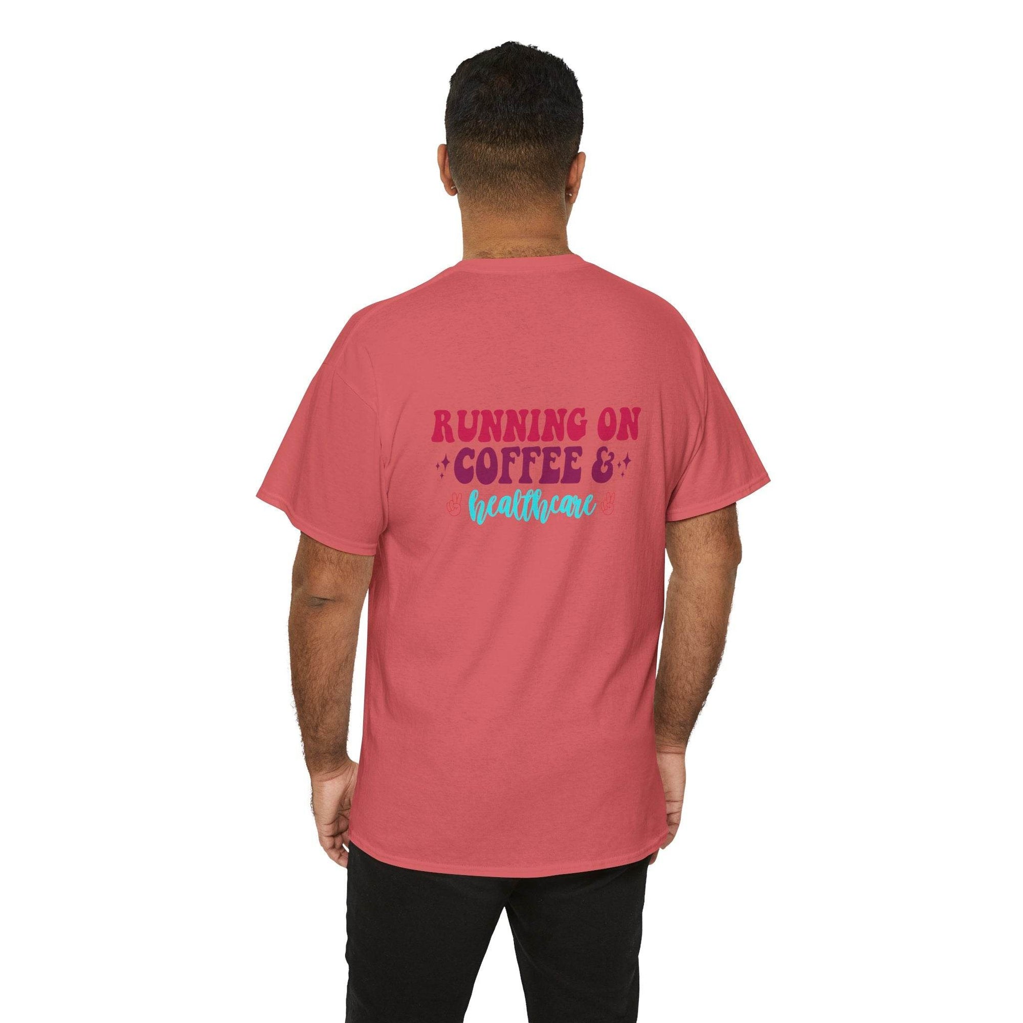 Back view of pink T-shirt with 'Running on Coffee & Healthcare' graphic in maroon and turquoise.