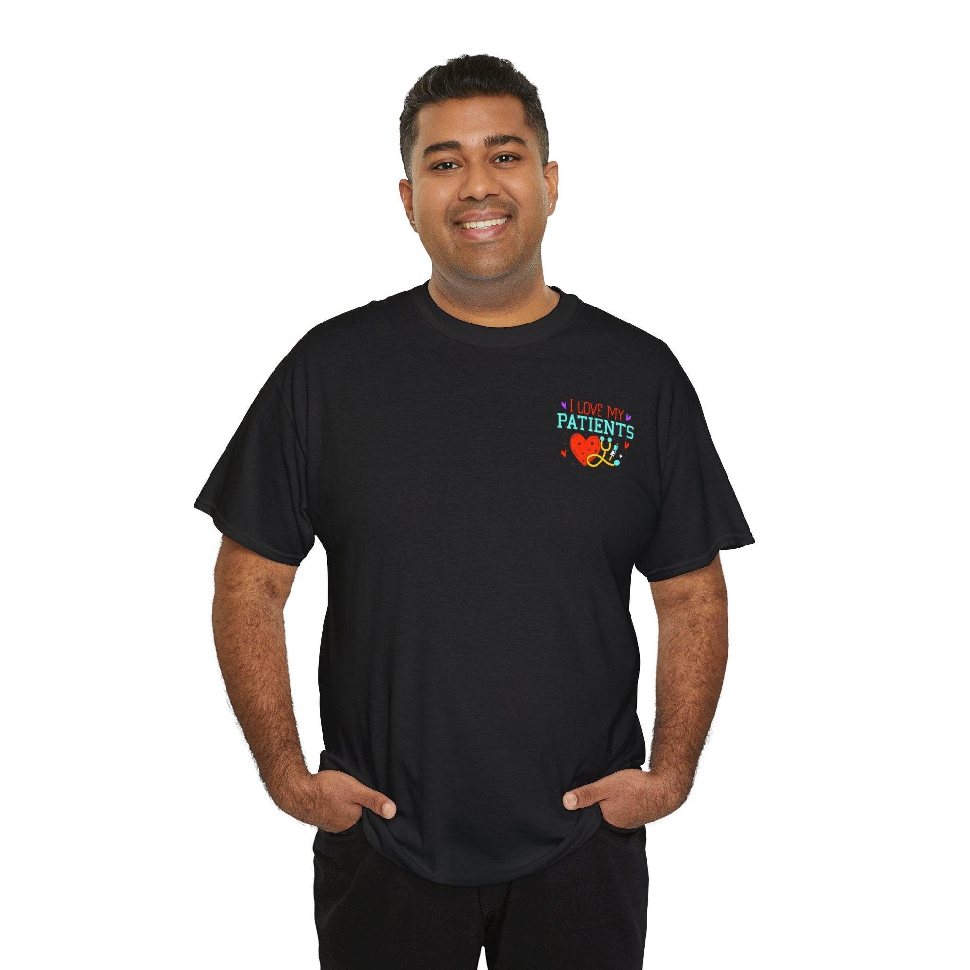 Smiling man wearing a black healthcare workers T-shirt with a left-chest graphic reading I Love My Patients.