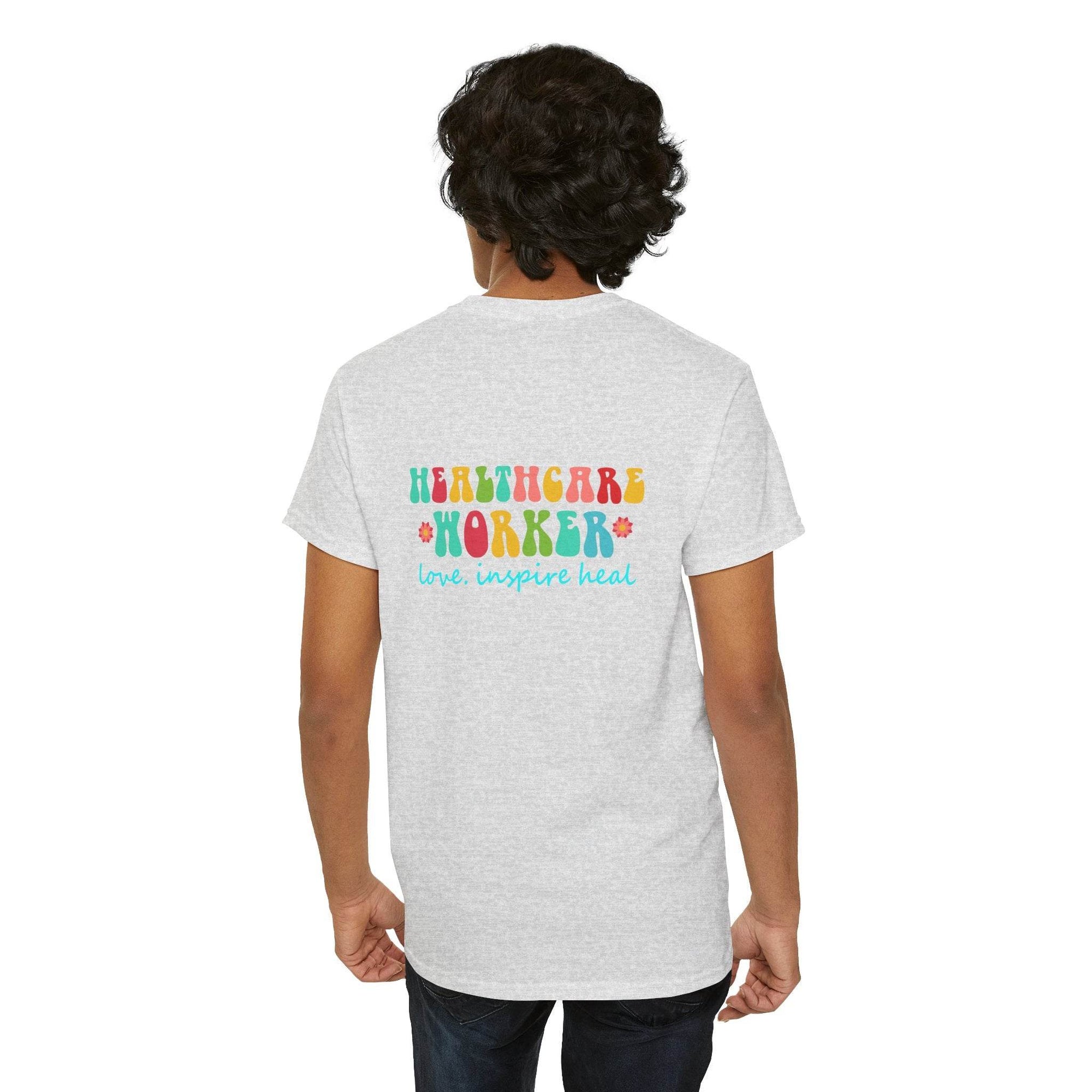 Back view of a gray Healthcare Worker T-shirt with colorful HEALTHCARE WORKER text and love inspire heal slogan.