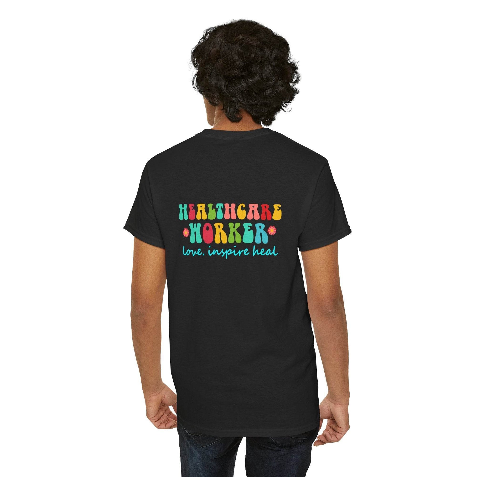 Back view of black Healthcare Workers T Shirt with colorful 'Healthcare Worker' lettering and blue 'love, inspire heal' slogan.